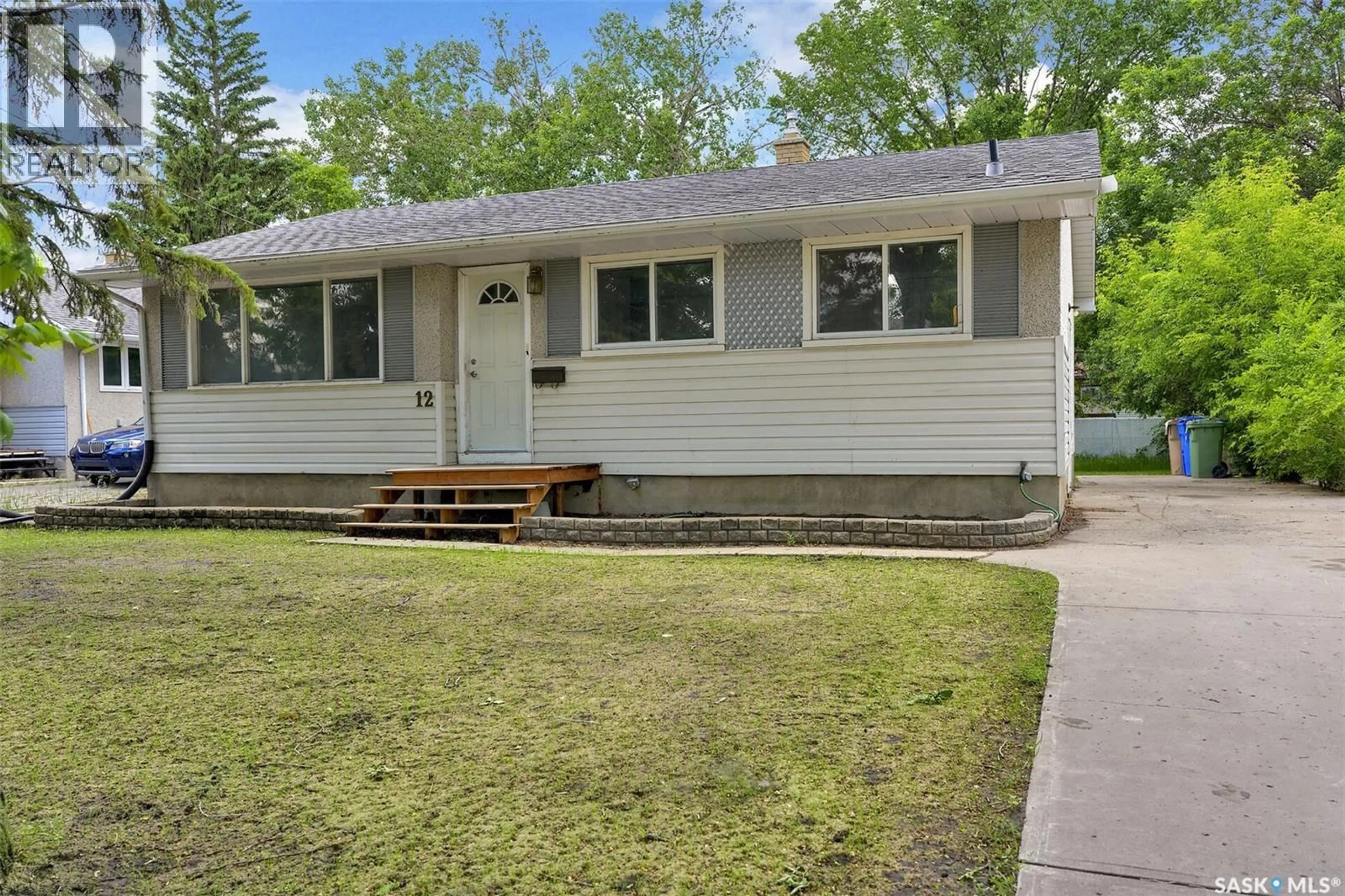 Home with vinyl exterior material, street for 12 BIRCHWOOD ROAD, Regina Saskatchewan S4S5N2