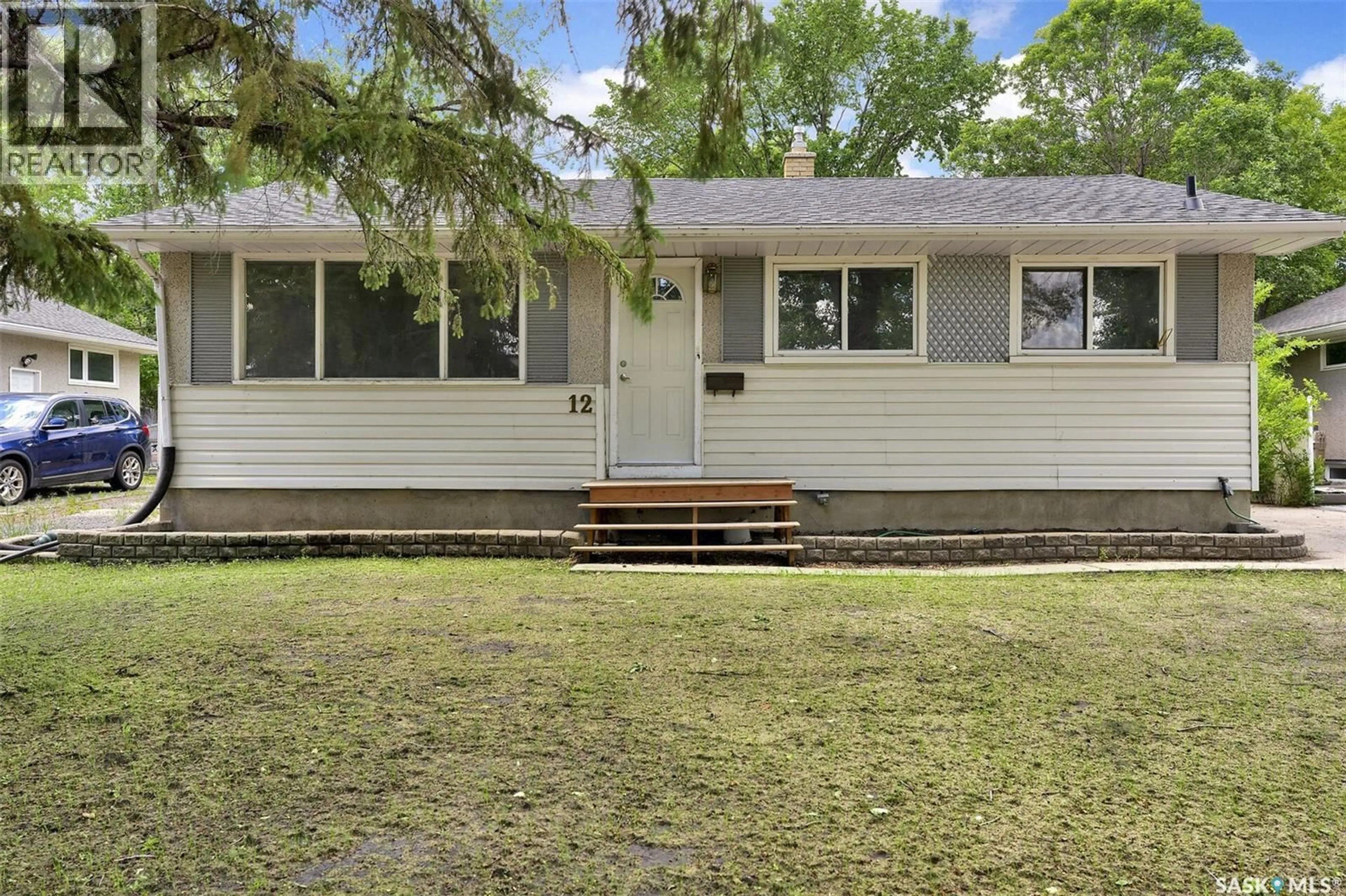 Home with vinyl exterior material, street for 12 BIRCHWOOD ROAD, Regina Saskatchewan S4S5N2