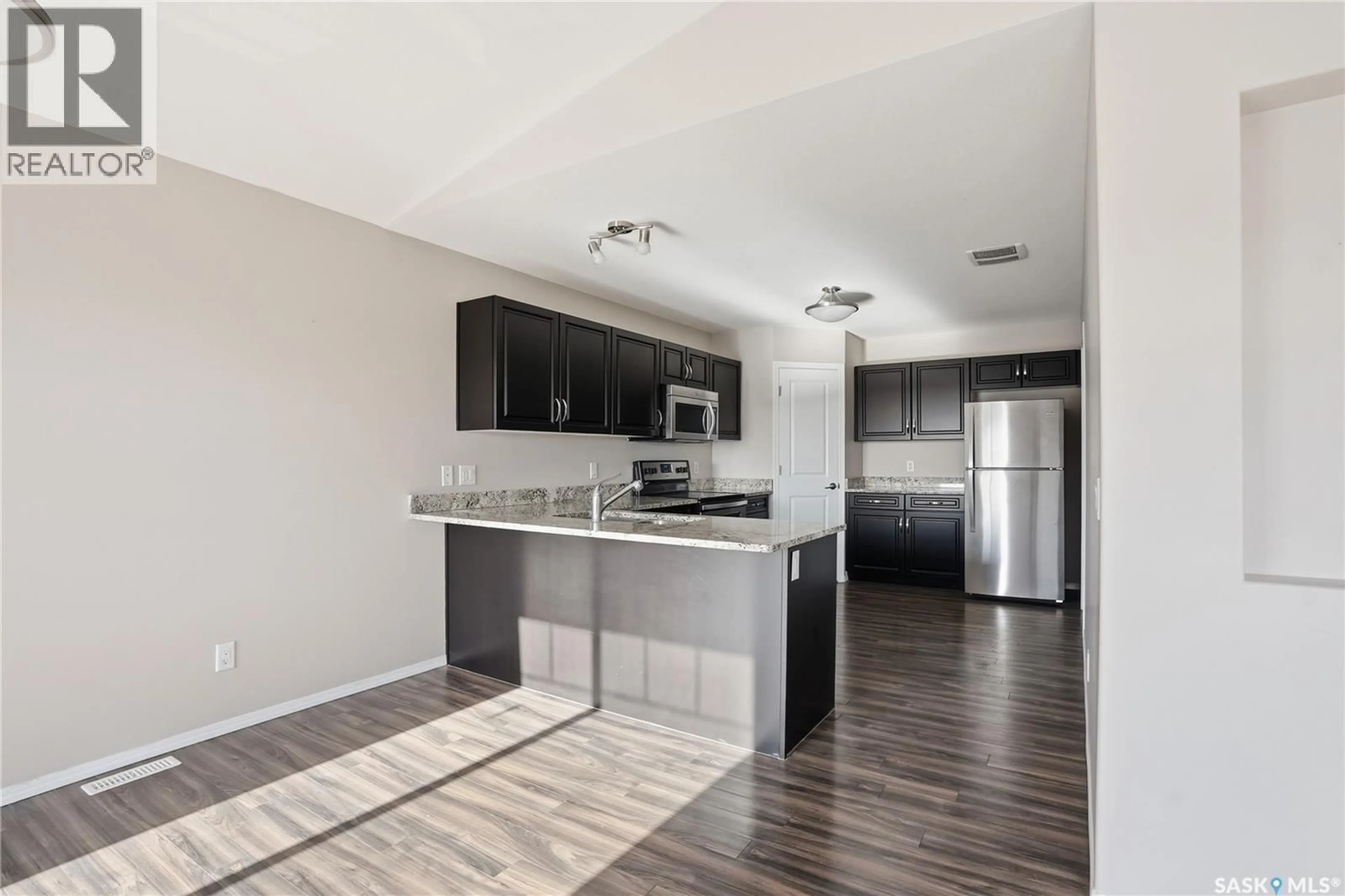 Open concept kitchen, unknown for 100 - 331 CHAPARRAL BOULEVARD, Martensville Saskatchewan S0K0A2