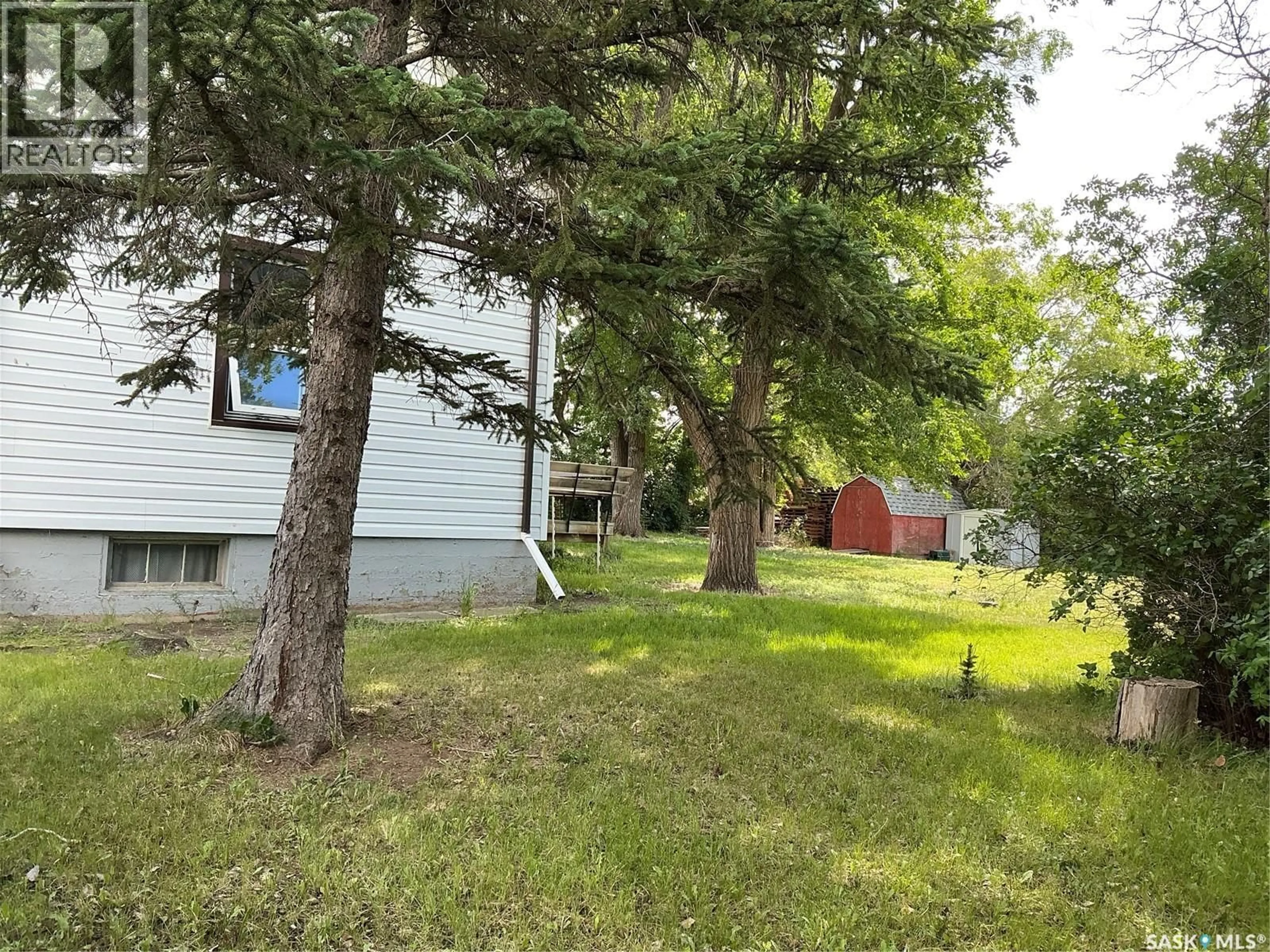 A pic from outside/outdoor area/front of a property/back of a property/a pic from drone, forest/trees view for 325 CENTRE STREET, Coronach Saskatchewan S0H0Z0