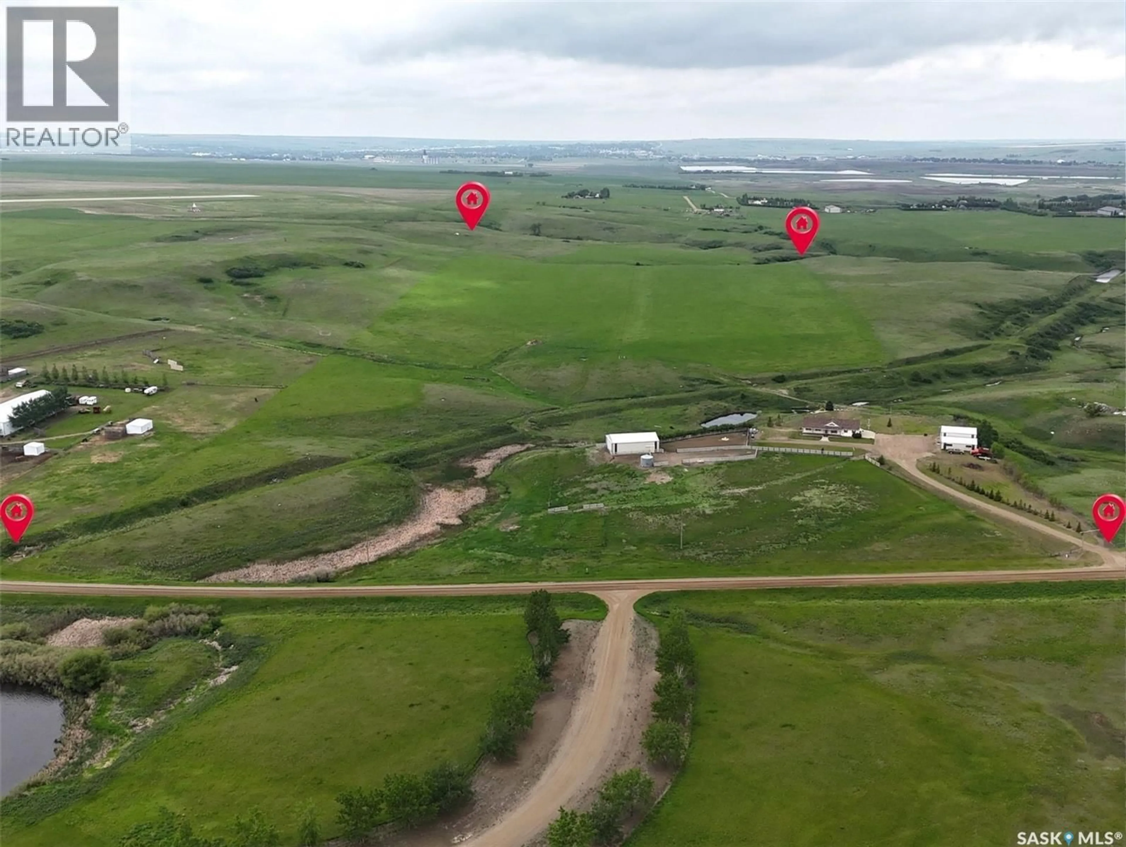 A pic from outside/outdoor area/front of a property/back of a property/a pic from drone, unknown for East - 1 ACREAGE, Swift Current Rm No. 137 Saskatchewan S9H4M6