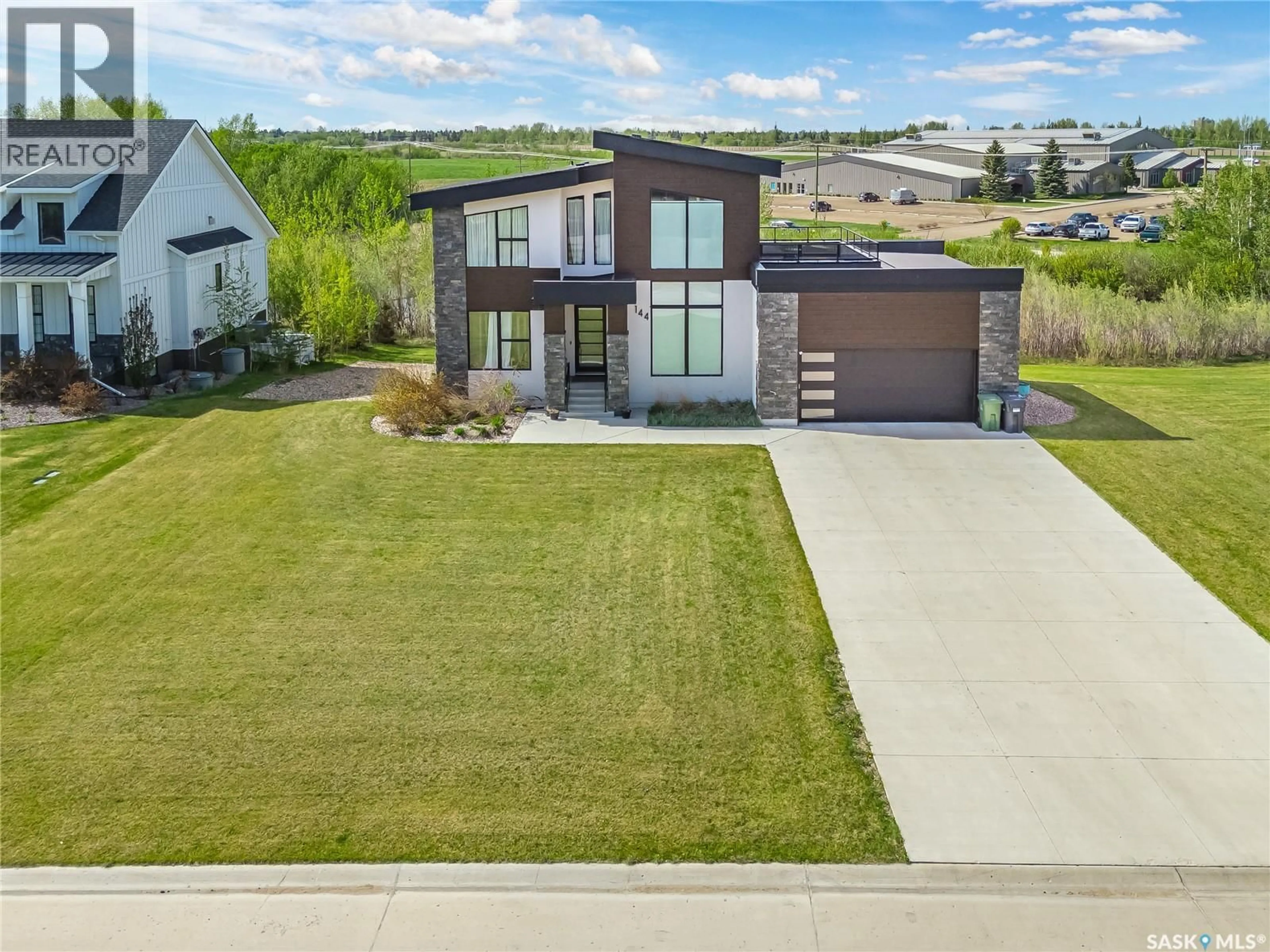 A pic from outside/outdoor area/front of a property/back of a property/a pic from drone, street for 144 GREENBRYRE STREET, Corman Park Rm No. 344 Saskatchewan S7V0J6
