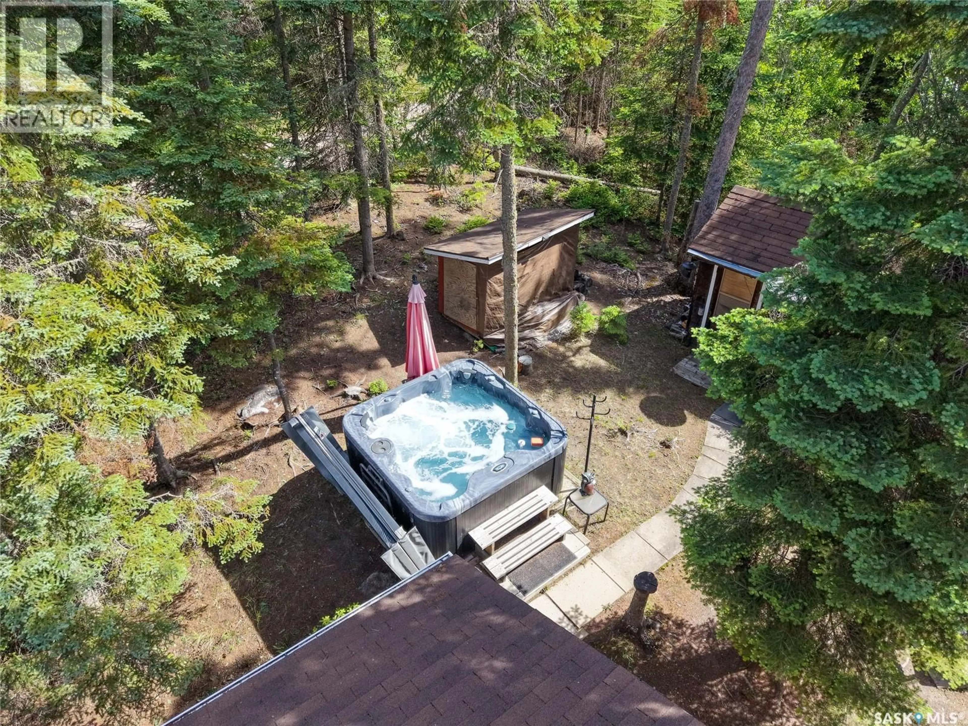 A pic from outside/outdoor area/front of a property/back of a property/a pic from drone, forest/trees view for 619 MARINE DRIVE, Emma Lake Saskatchewan S0J0N0