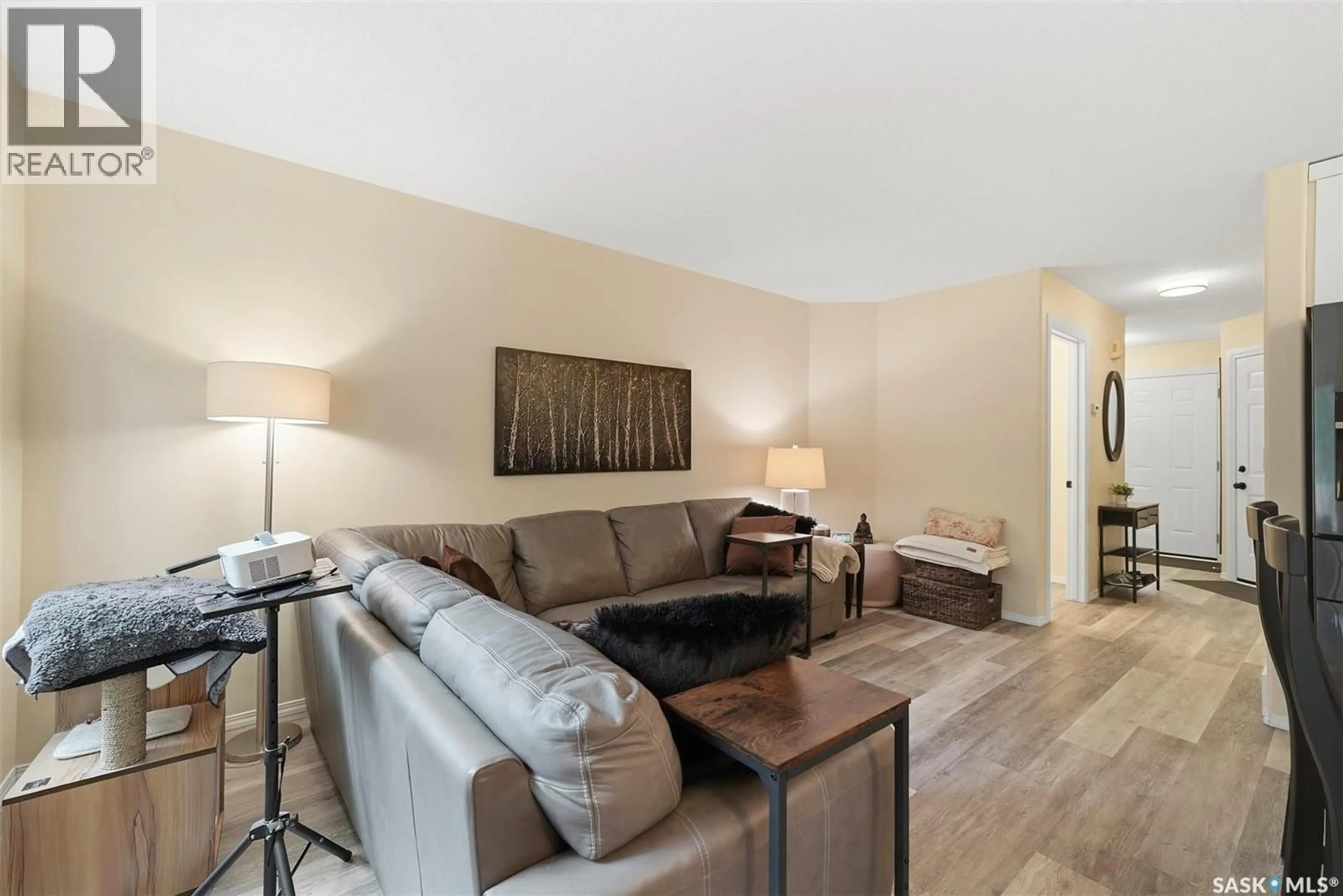 Living room with furniture, wood/laminate floor for 12 103 BERINI DRIVE, Saskatoon Saskatchewan S7N4N2