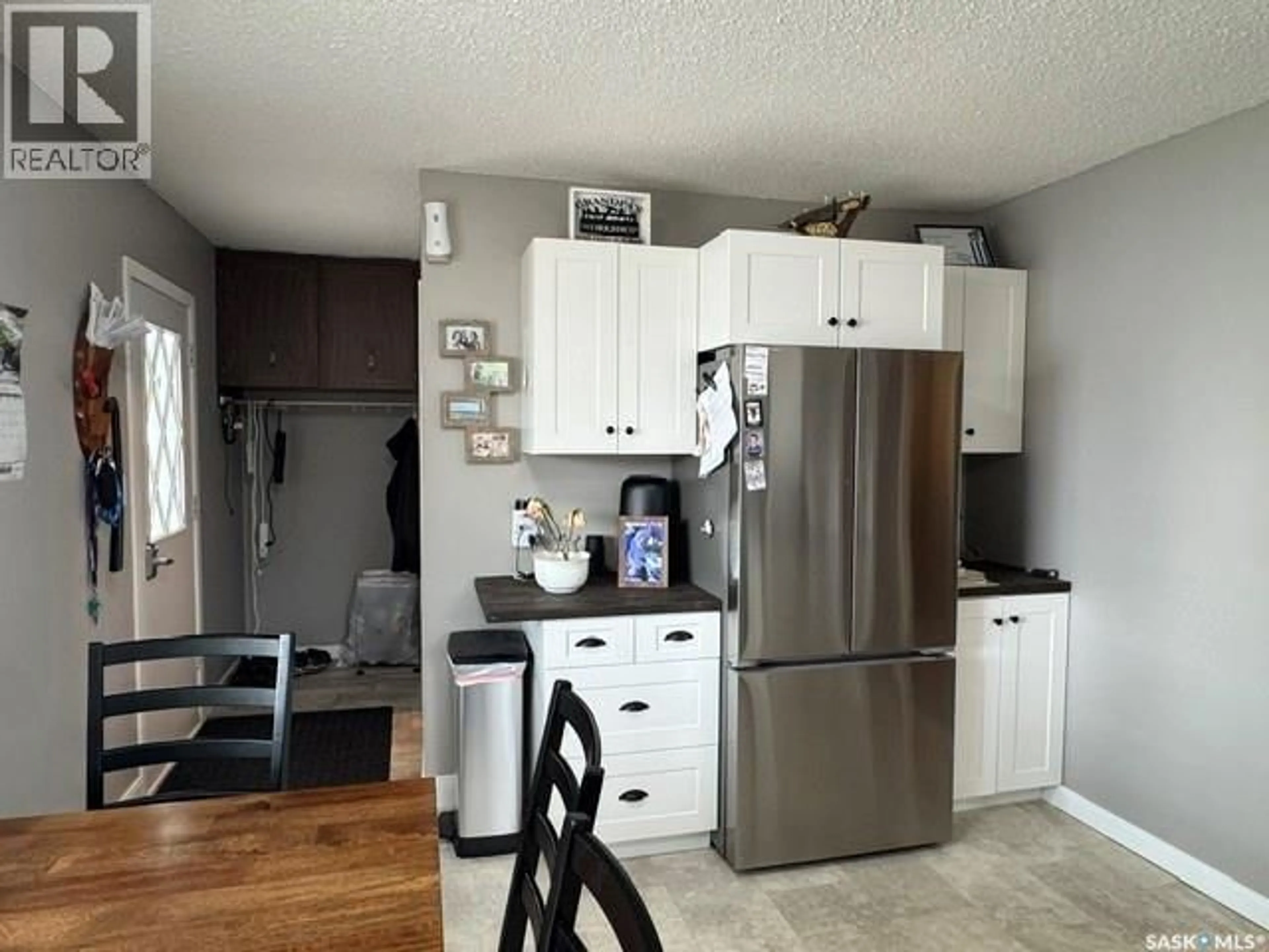 Open concept kitchen, wood/laminate floor for 628 10TH STREET, Humboldt Saskatchewan S0K2A0