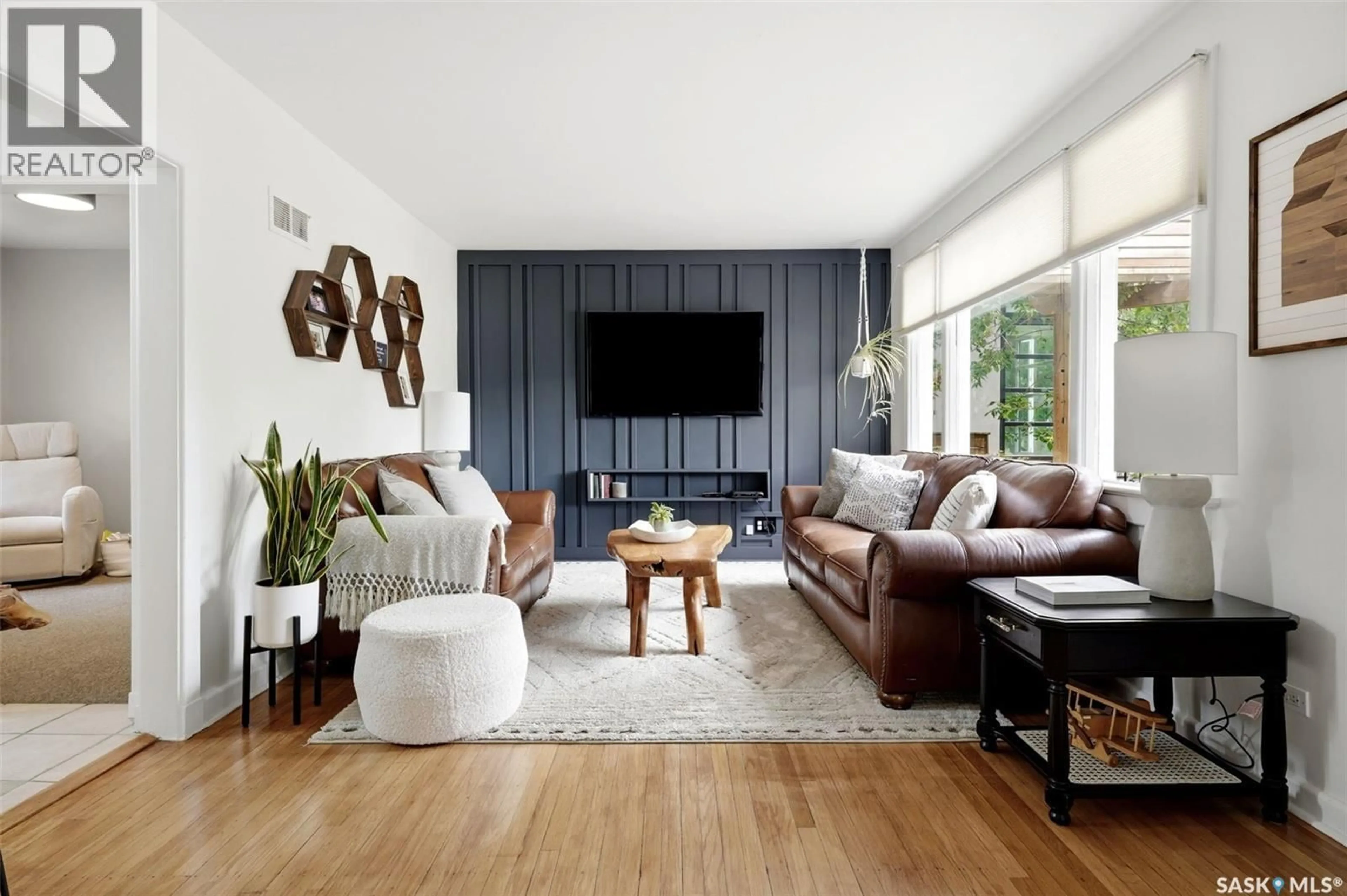 Living room with furniture, wood/laminate floor for 2876 CAMERON STREET, Regina Saskatchewan S4S1W3