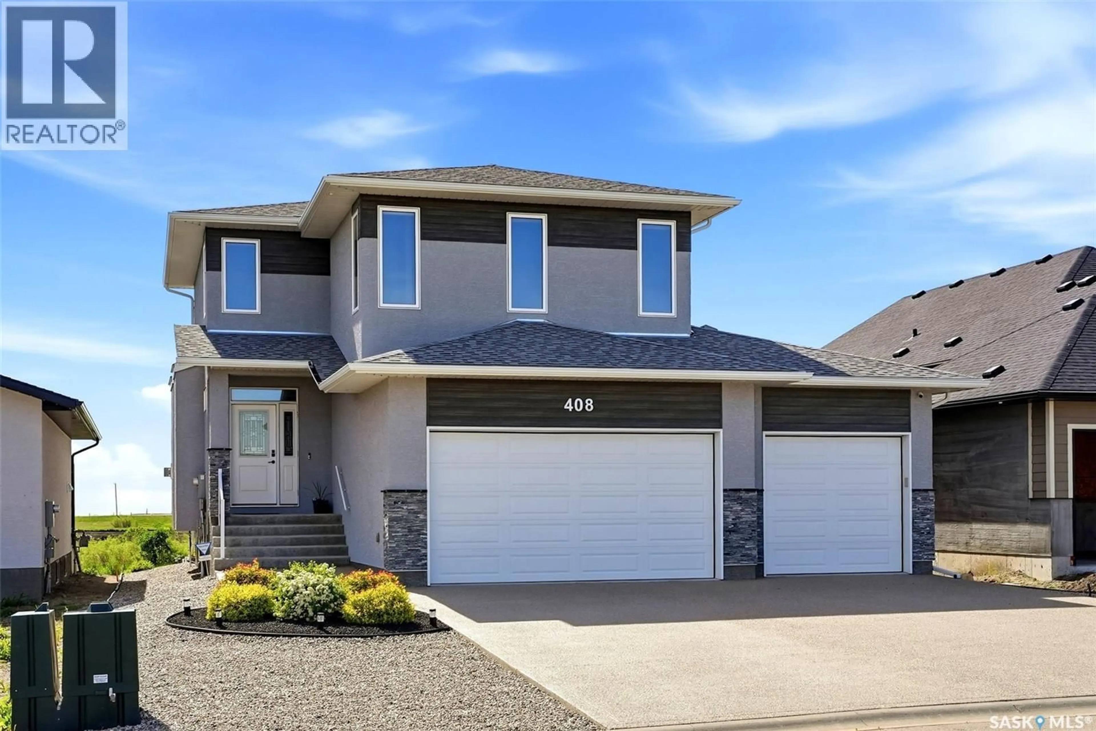 Home with vinyl exterior material, street for 408 HILLSIDE DRIVE, Pilot Butte Saskatchewan S0G3Z0