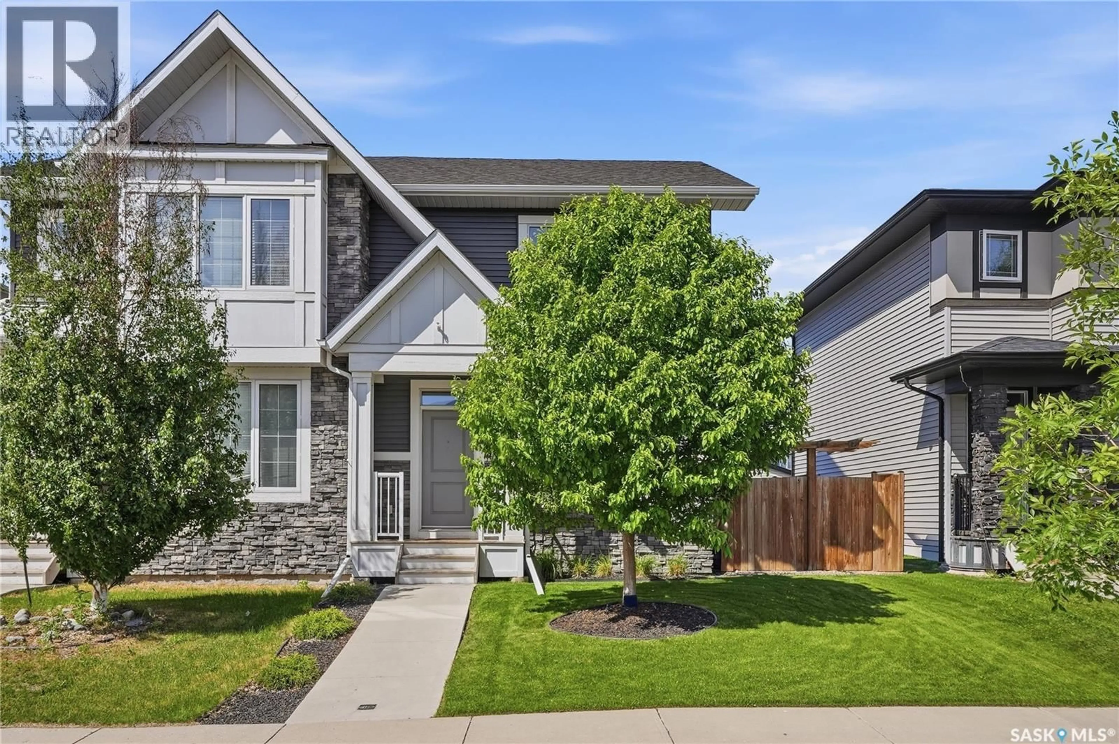 Home with brick exterior material, street for 4032 CENTENNIAL DRIVE, Saskatoon Saskatchewan S7L6R1