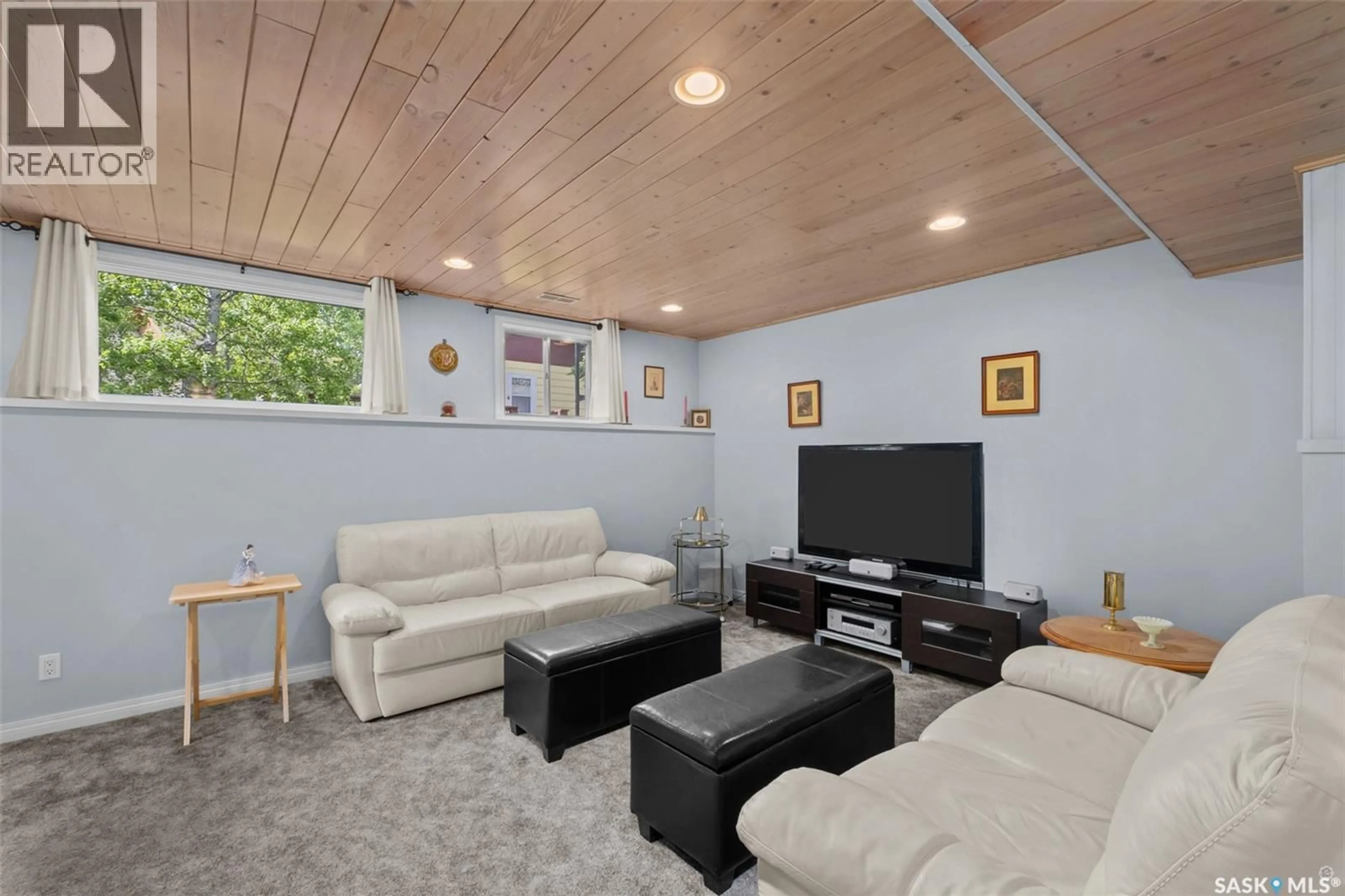 Living room with furniture, wood/laminate floor for 109 BEAVER PLACE, McPhee Lake Saskatchewan S0J2Y0