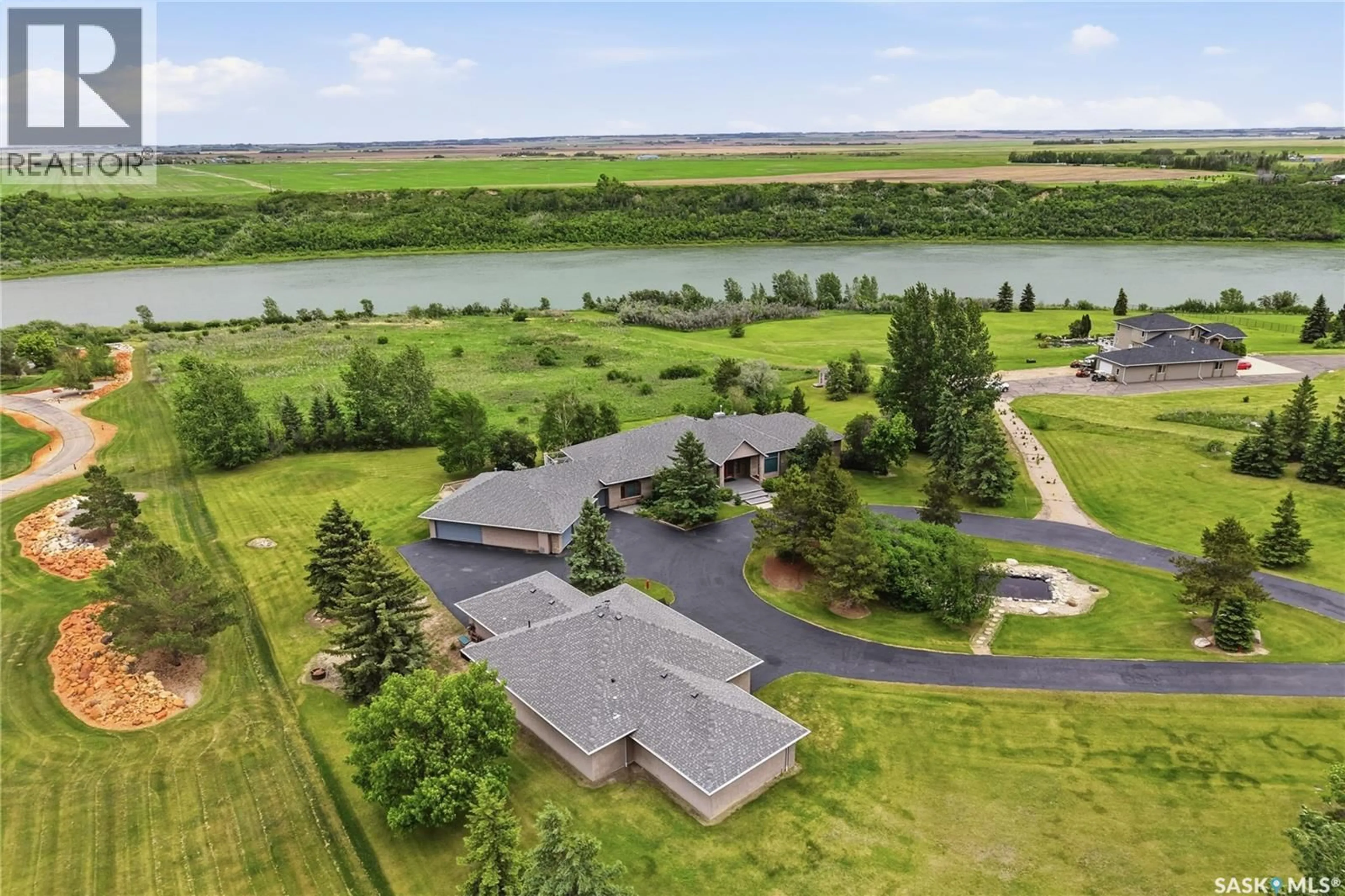 A pic from outside/outdoor area/front of a property/back of a property/a pic from drone, water/lake/river/ocean view for 48 CATHEDRAL BLUFFS ROAD, Corman Park Rm No. 344 Saskatchewan S7P1A3