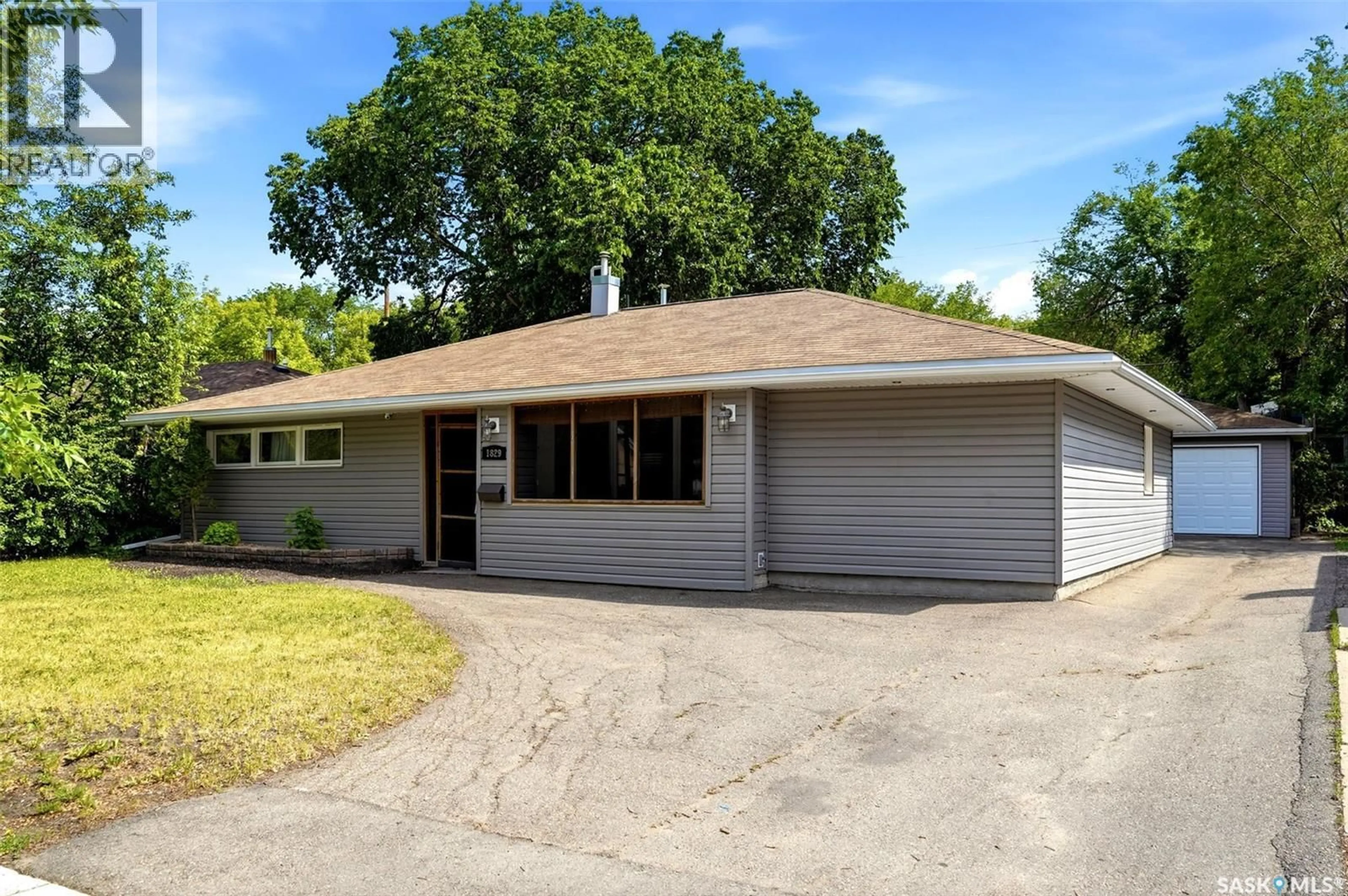 Home with vinyl exterior material, street for 1829 GRANT DRIVE, Regina Saskatchewan S4S4V5