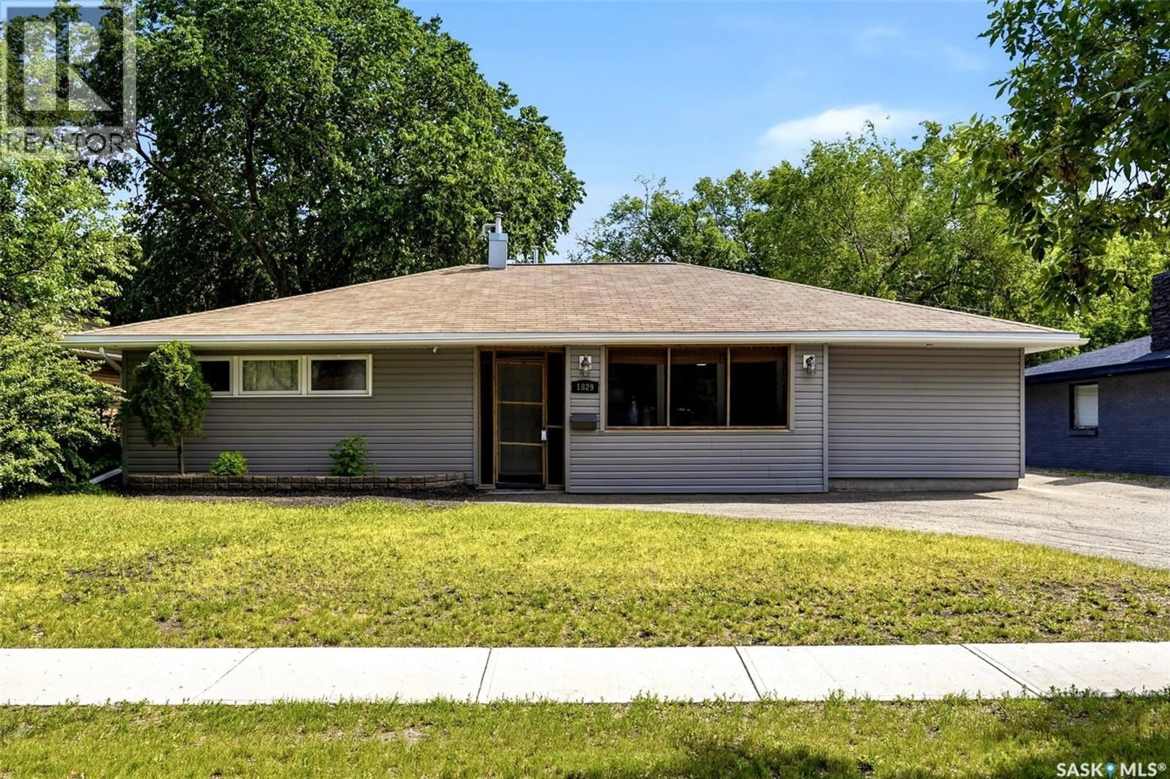 Home with vinyl exterior material, street for 1829 GRANT DRIVE, Regina Saskatchewan S4S4V5