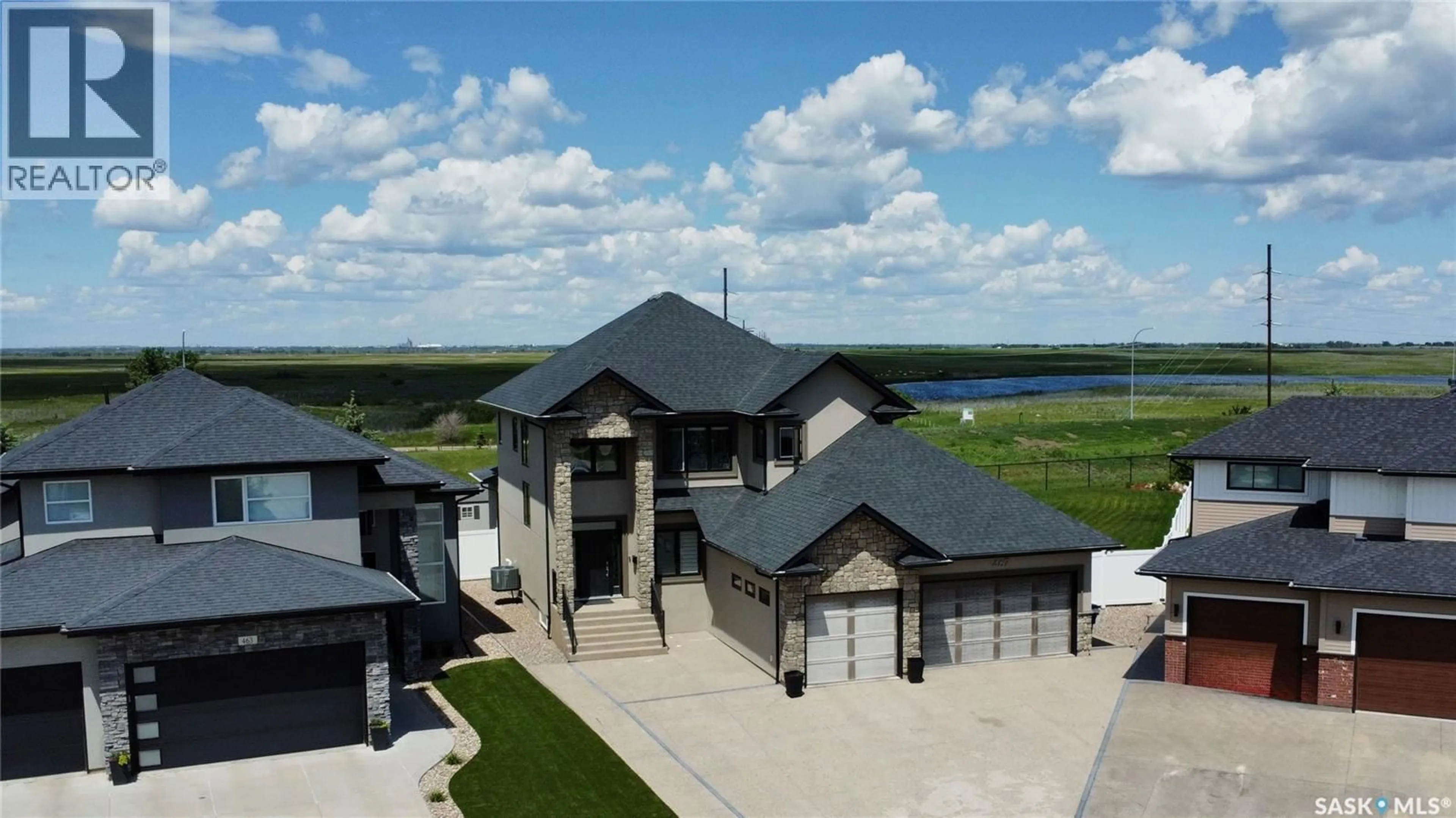 A pic from outside/outdoor area/front of a property/back of a property/a pic from drone, water/lake/river/ocean view for 467 MAHABIR CRESCENT, Saskatoon Saskatchewan S7W0J7