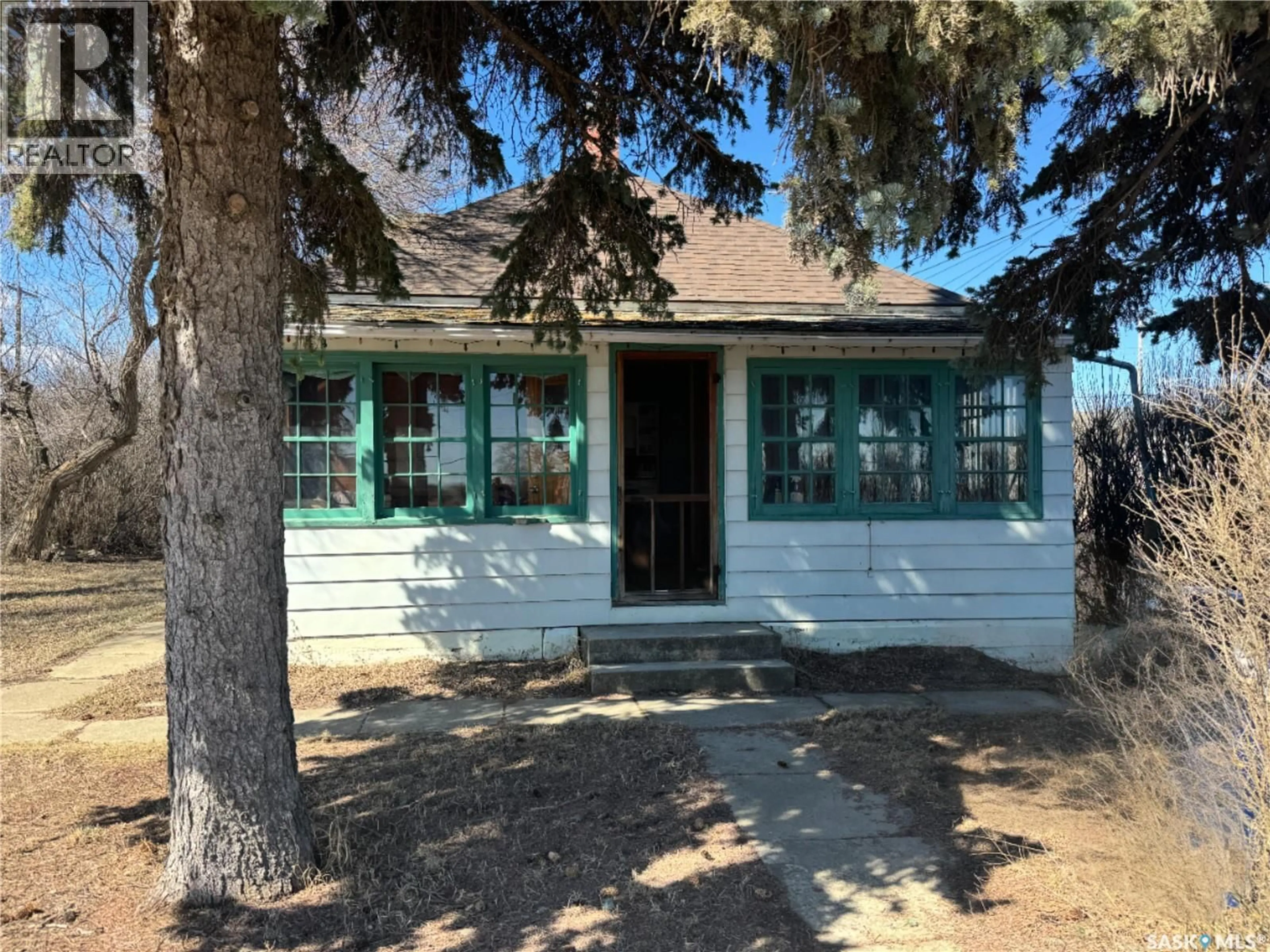 Home with vinyl exterior material, street for 1102 7TH STREET, Perdue Saskatchewan S0K3C0