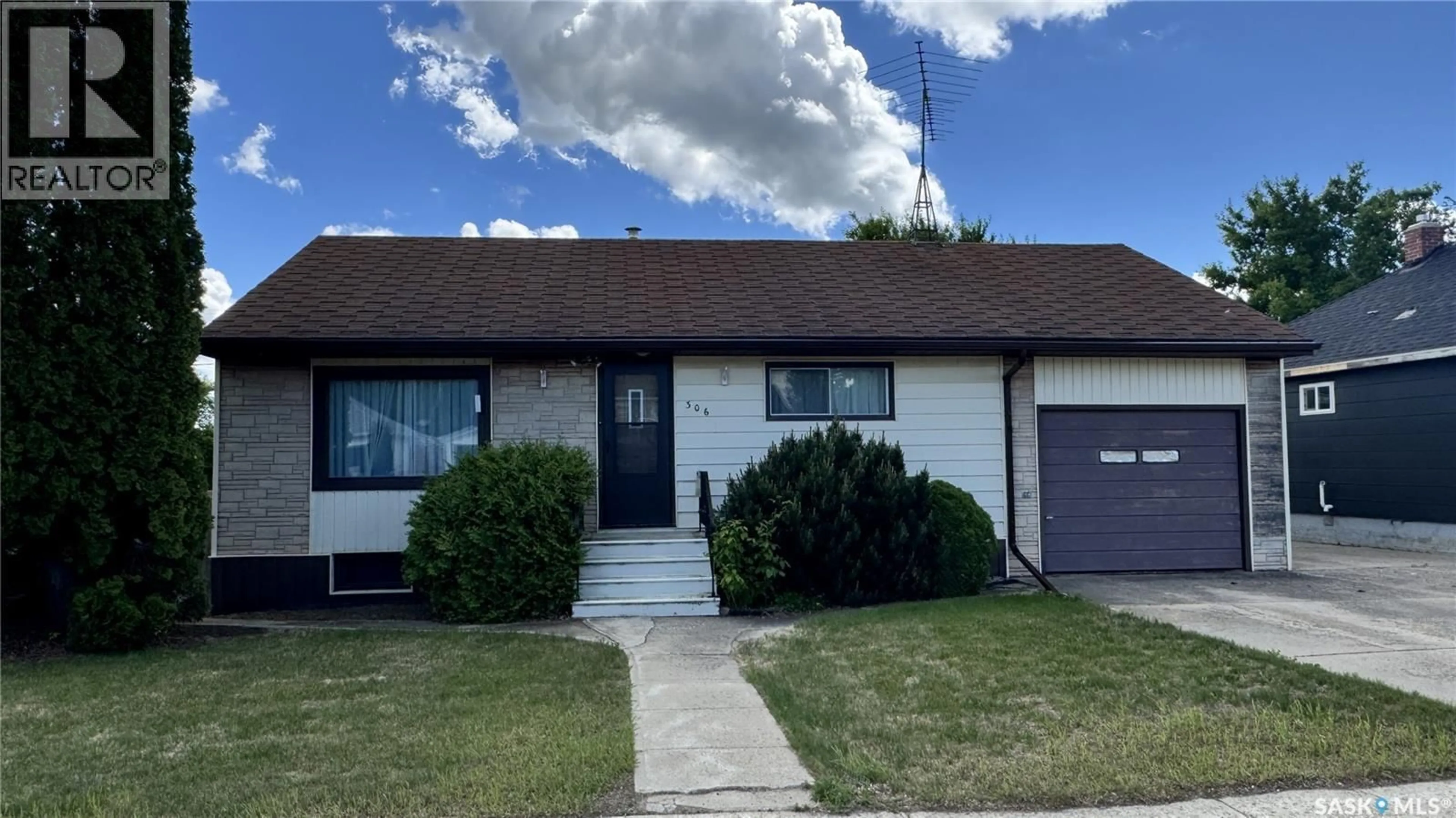 Home with vinyl exterior material, street for 306 6TH AVENUE, Biggar Saskatchewan S0K0M0