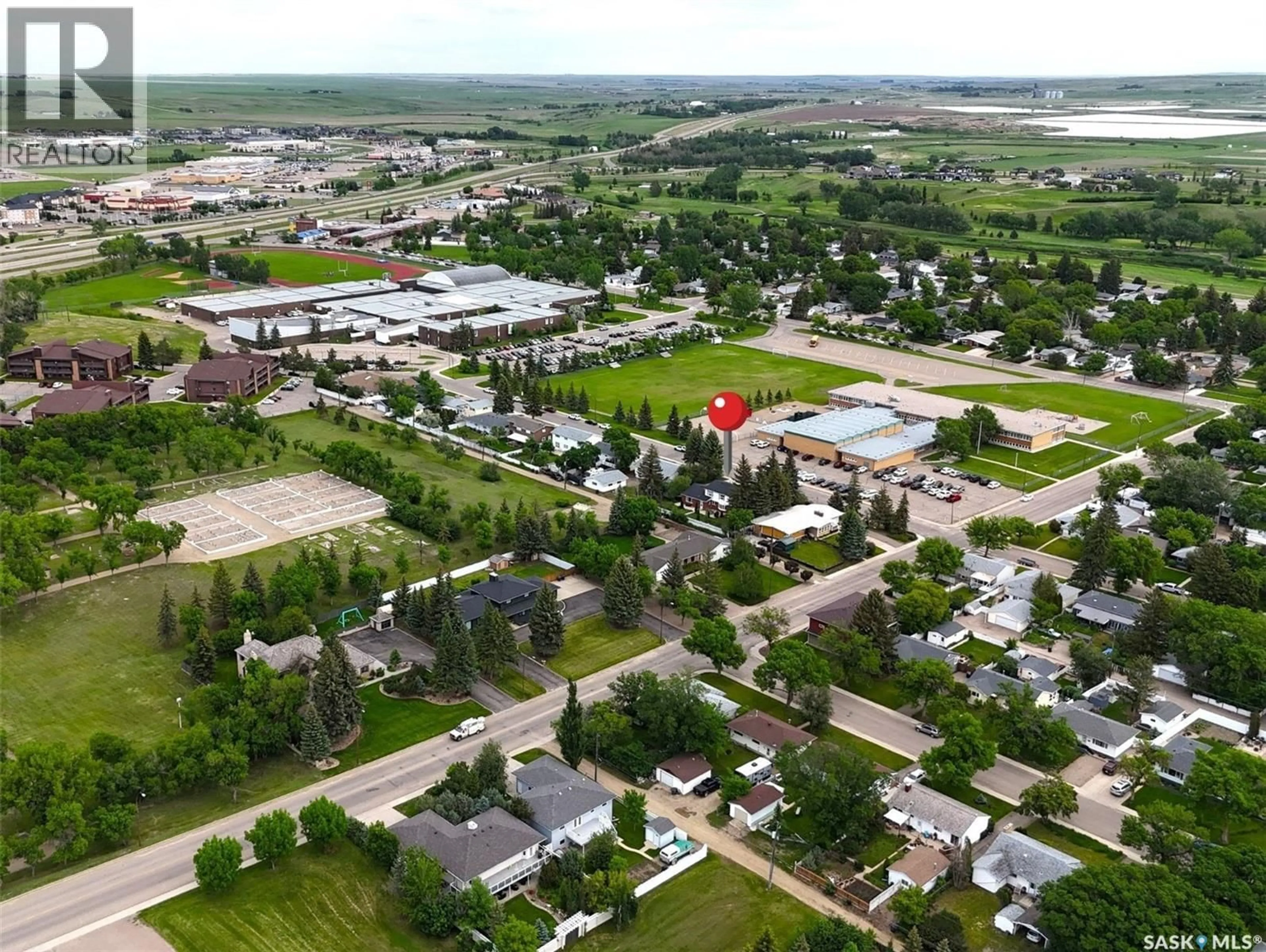 A pic from outside/outdoor area/front of a property/back of a property/a pic from drone, street for 940 9TH AVENUE, Swift Current Saskatchewan S9H2S9
