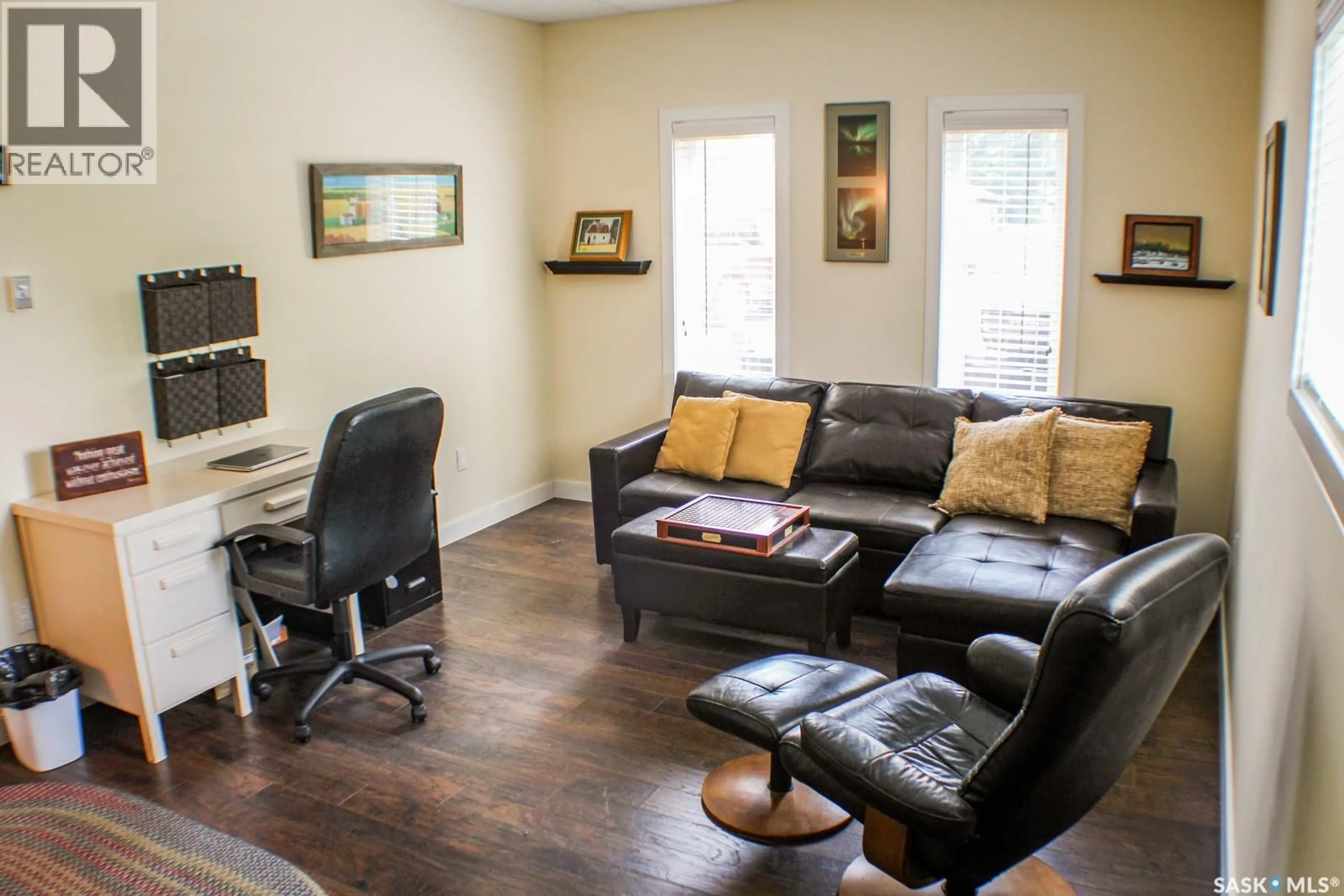 Living room with furniture, wood/laminate floor for 110 BAILLIE ROAD, Willow Creek Rm No. 458 Saskatchewan S0E0T0