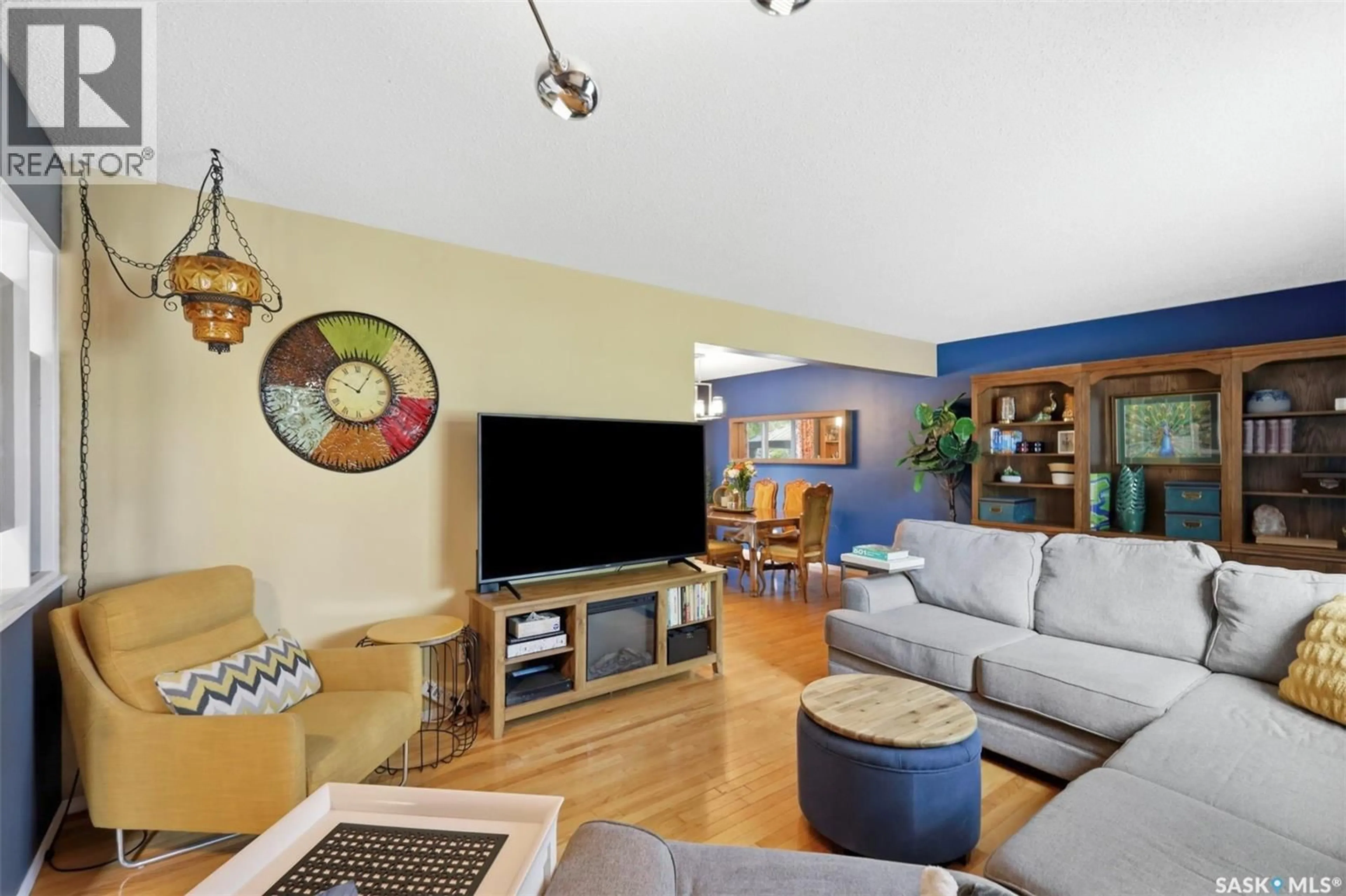 Living room with furniture, wood/laminate floor for 1660 ALEXANDRA AVENUE, Saskatoon Saskatchewan S7K3C3