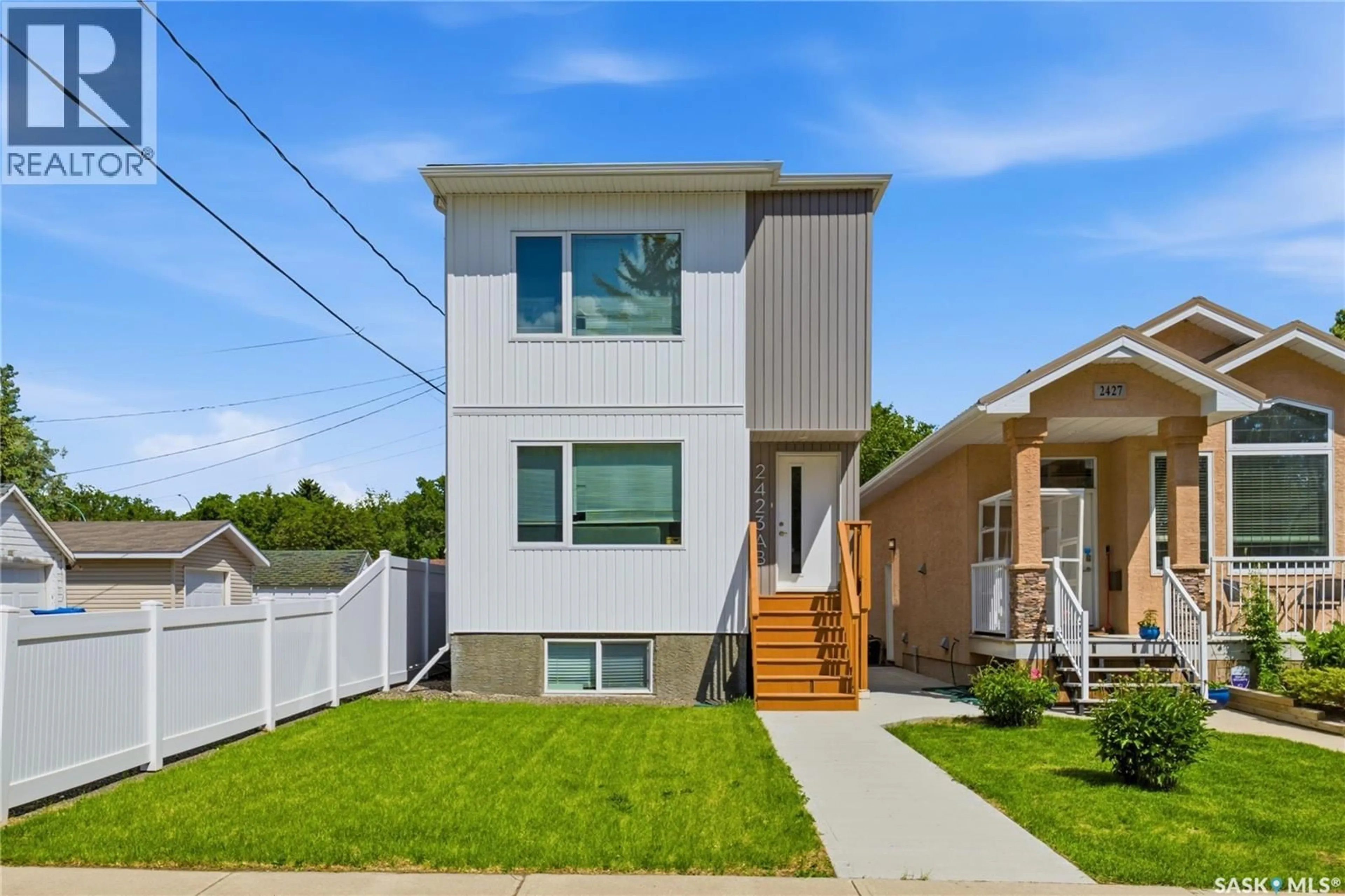 Home with vinyl exterior material, street for 2423 REYNOLDS STREET, Regina Saskatchewan S4N3N8