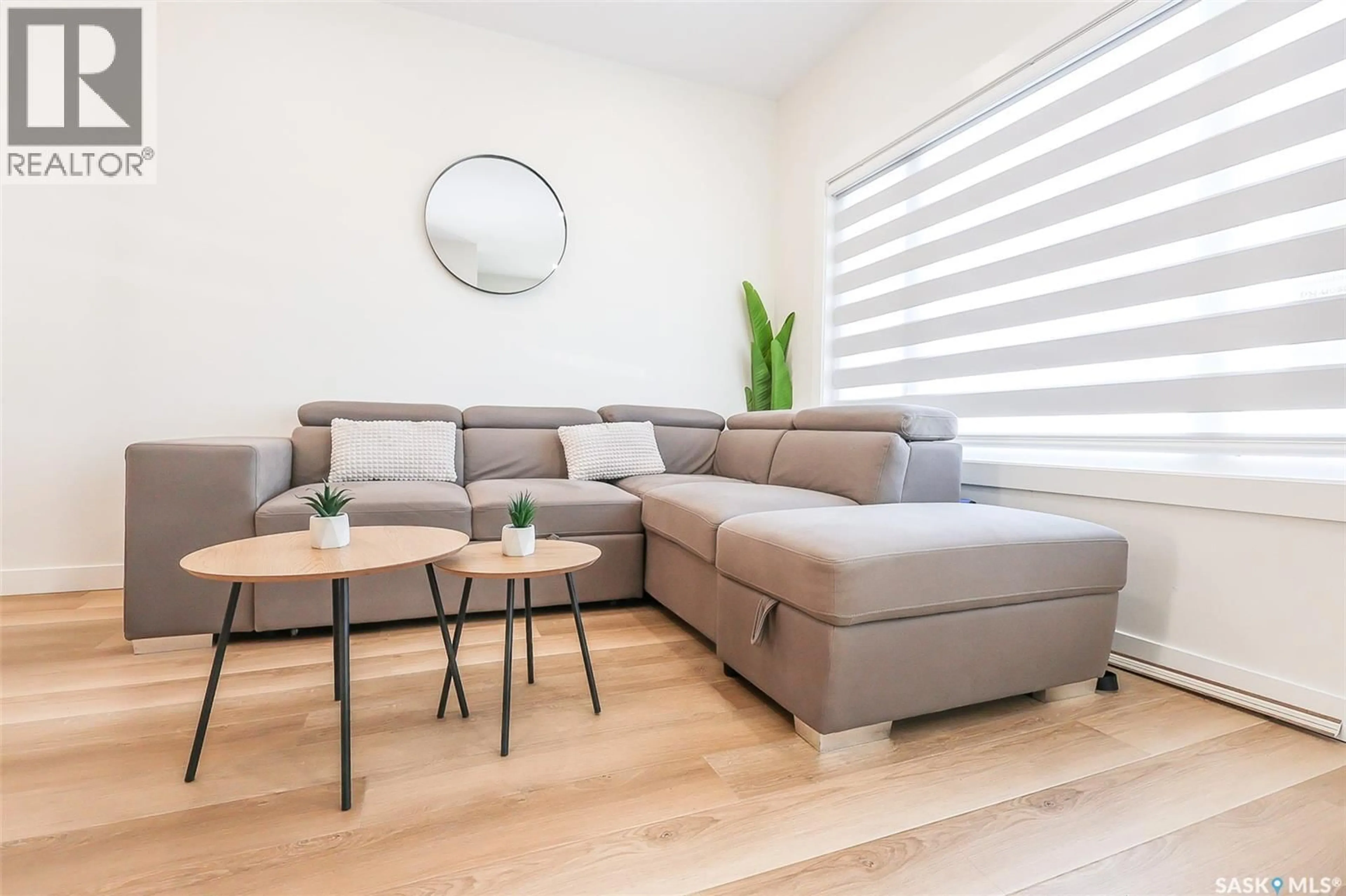 Living room with furniture, wood/laminate floor for 1615 - 159 RICHARDSON ROAD, Saskatoon Saskatchewan S7R0N3