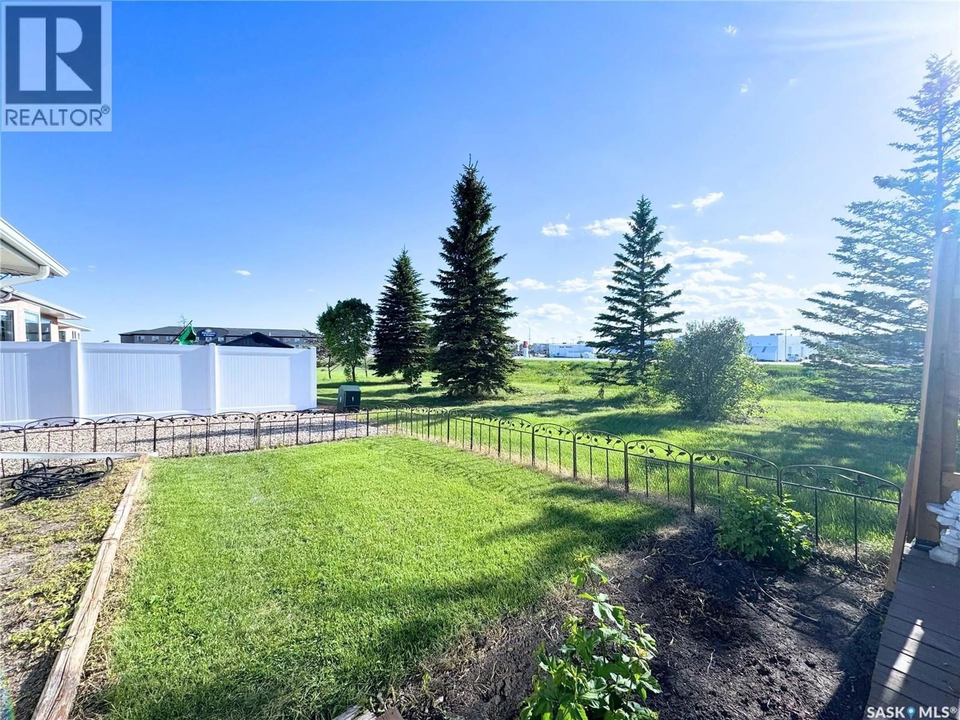 A pic from outside/outdoor area/front of a property/back of a property/a pic from drone, water/lake/river/ocean view for 30 - 103 RUSSELL DRIVE, Yorkton Saskatchewan S3N4C6