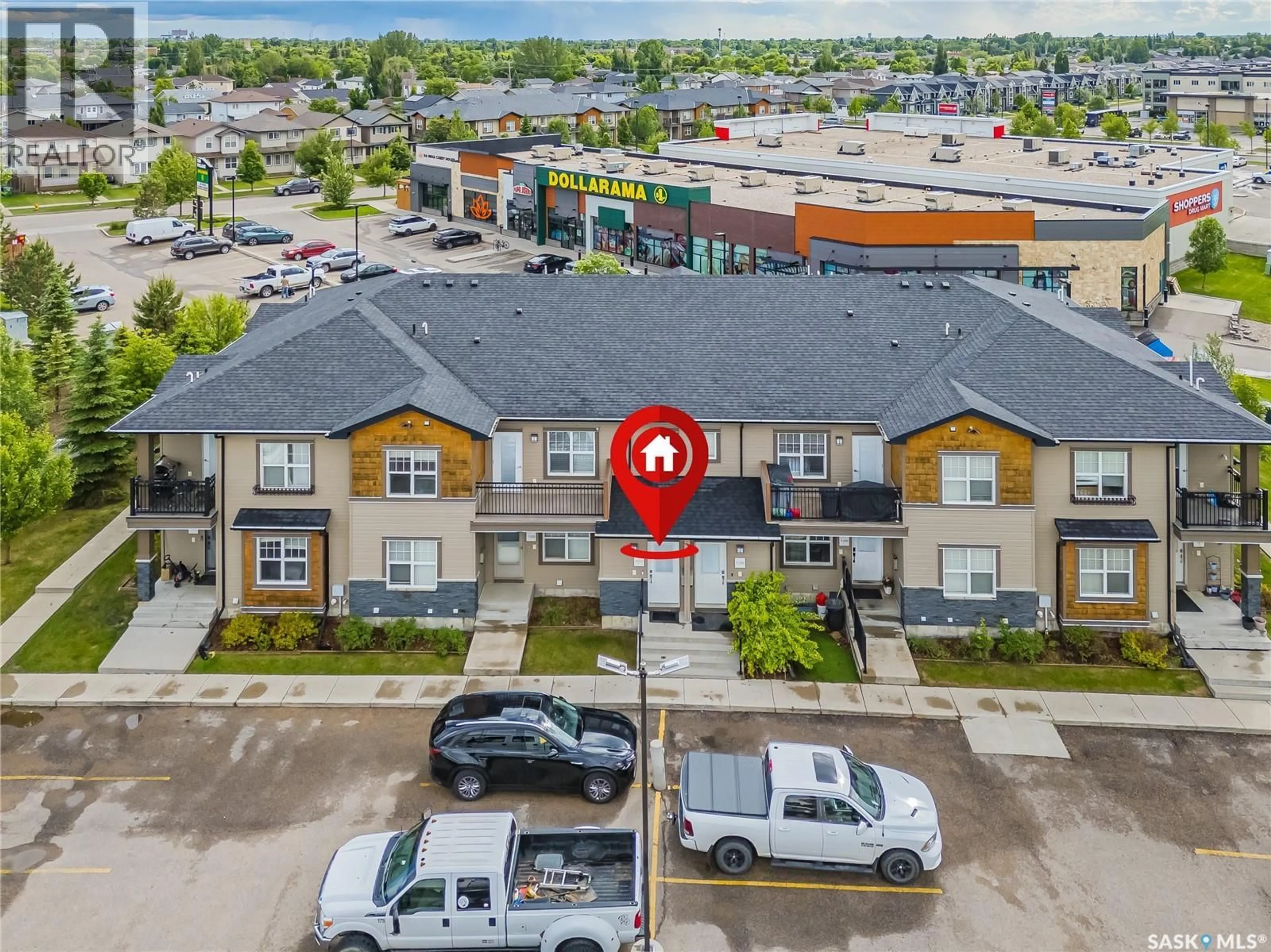 A pic from outside/outdoor area/front of a property/back of a property/a pic from drone, street for 107 - 1120 HAMPTON CIRCLE, Saskatoon Saskatchewan S7R0L9