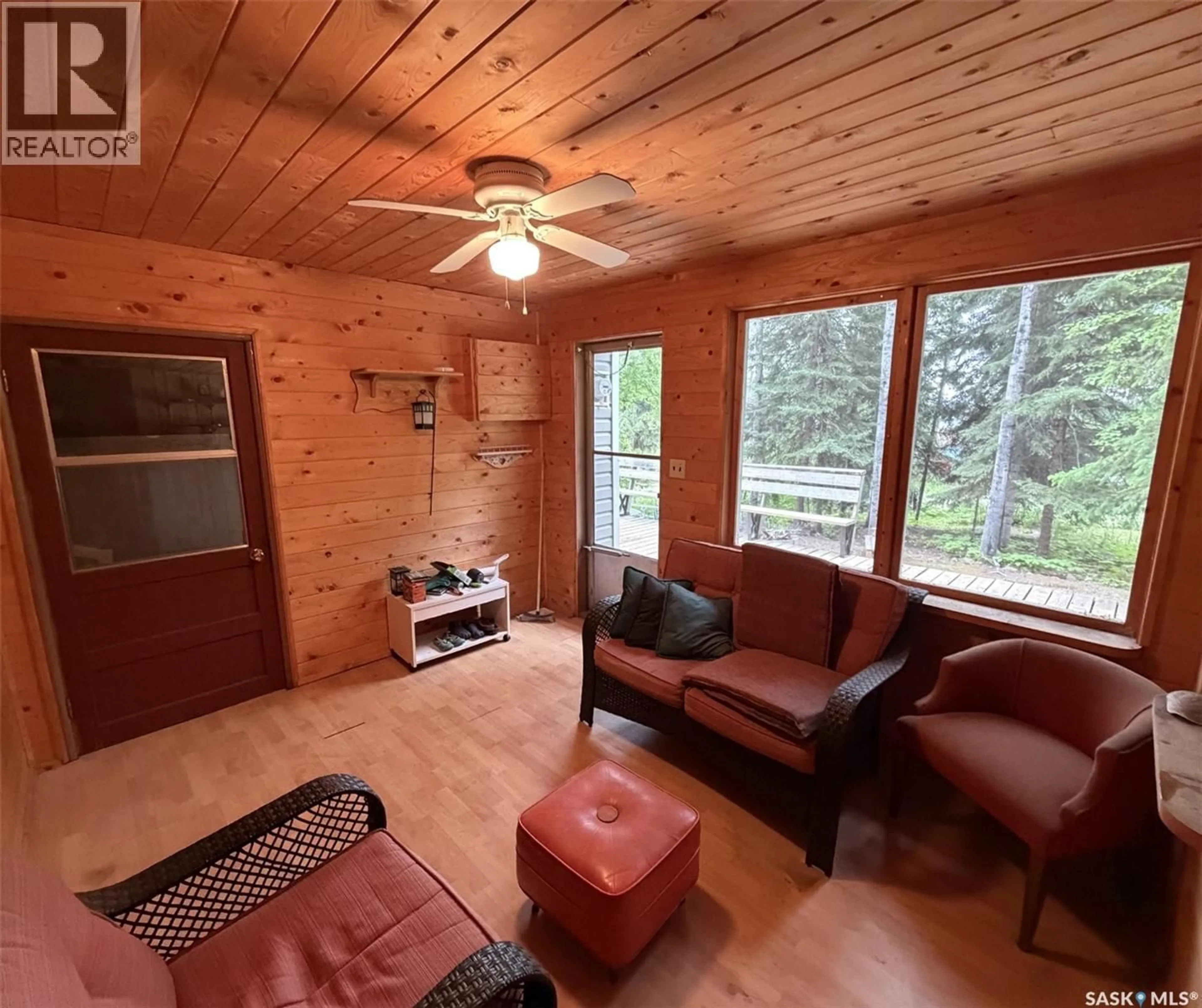 Living room with furniture, wood/laminate floor for 1505 WILLOW STREET, Northern Admin District Saskatchewan S0J1L0