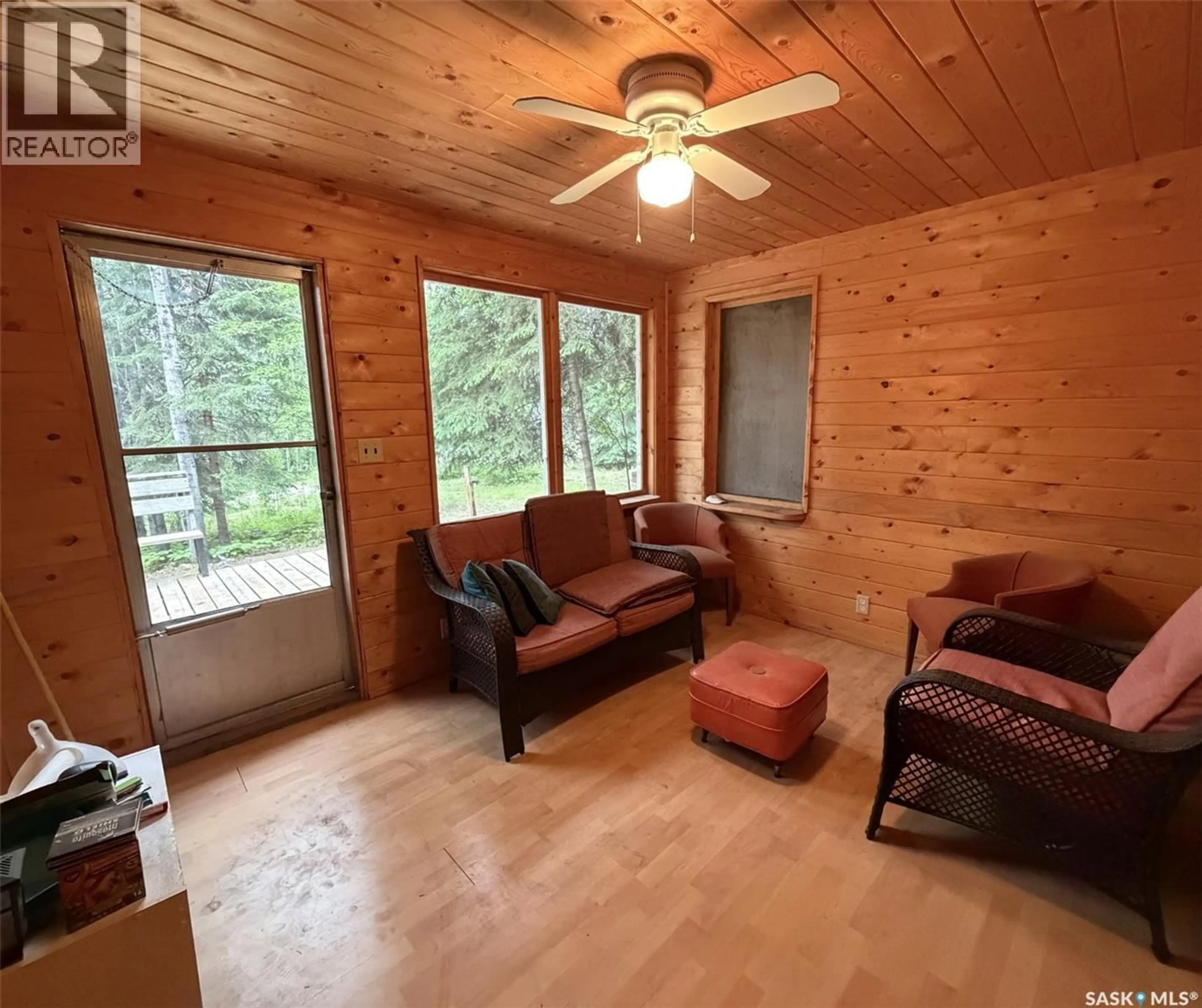 Living room with furniture, wood/laminate floor for 1505 WILLOW STREET, Northern Admin District Saskatchewan S0J1L0