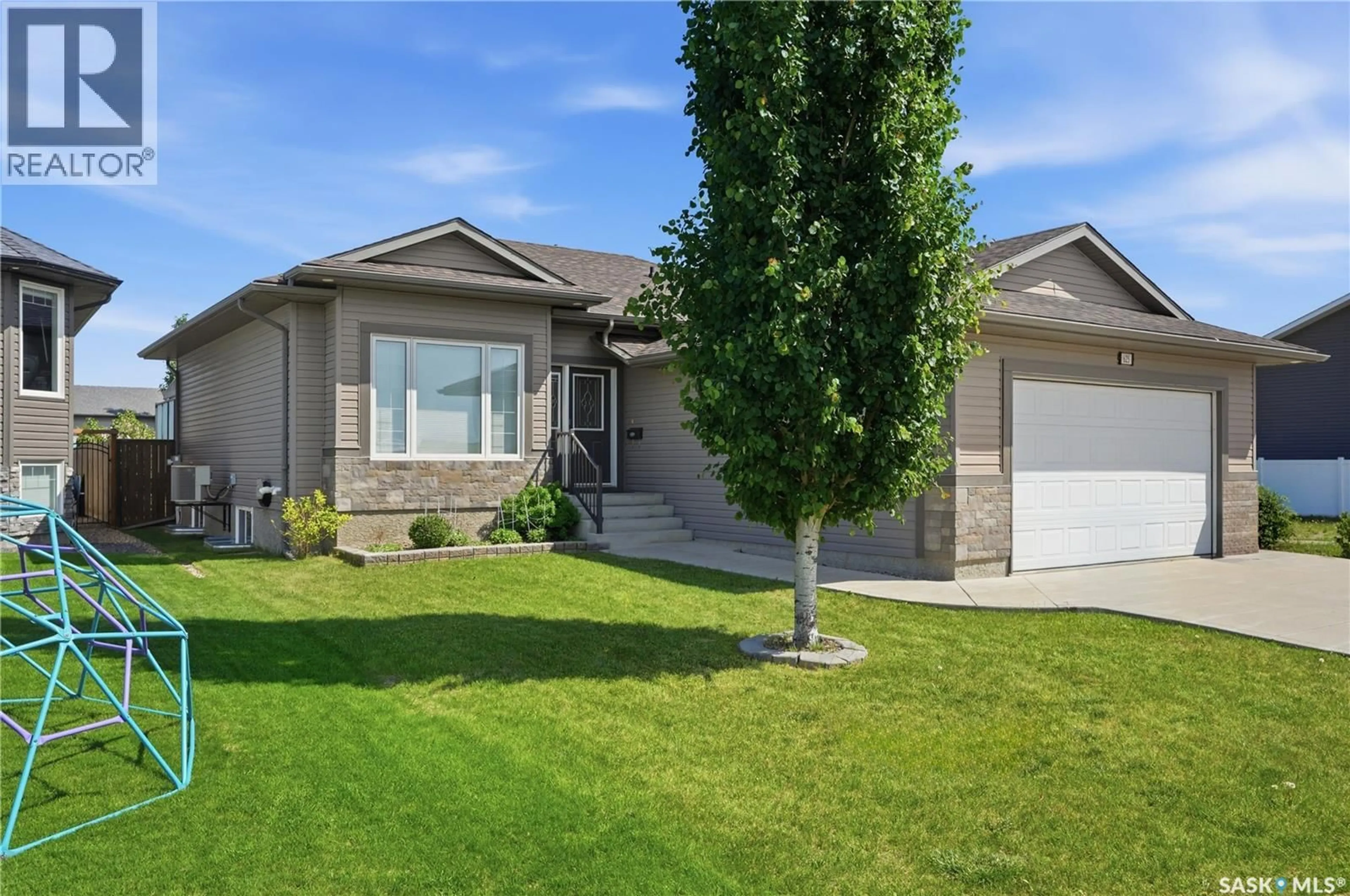 Home with vinyl exterior material, street for 625 REIMER ROAD, Martensville Saskatchewan S0K0A2