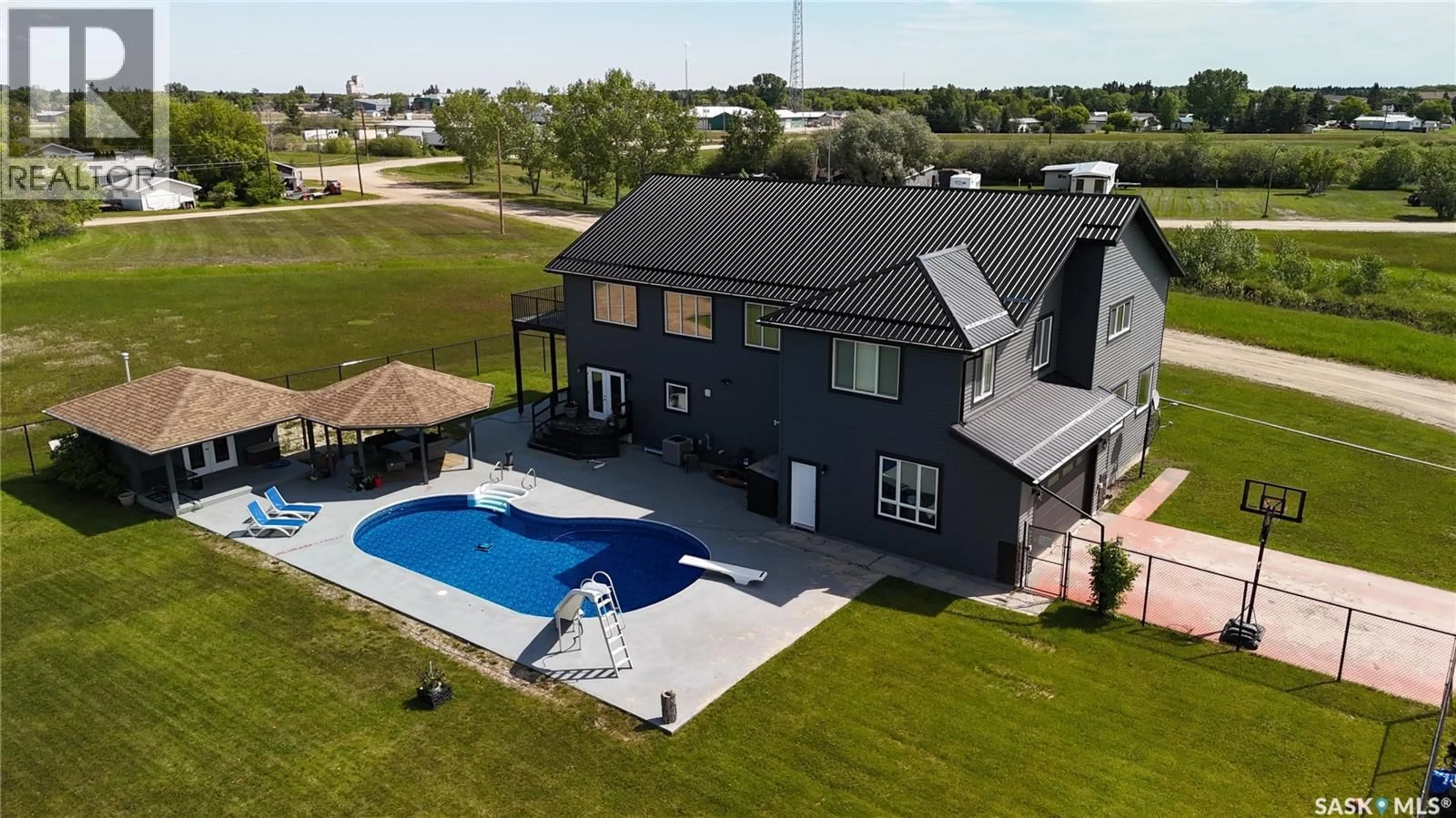 A pic from outside/outdoor area/front of a property/back of a property/a pic from drone, water/lake/river/ocean view for 701 BAY STREET, Hudson Bay Saskatchewan S0E0Y0