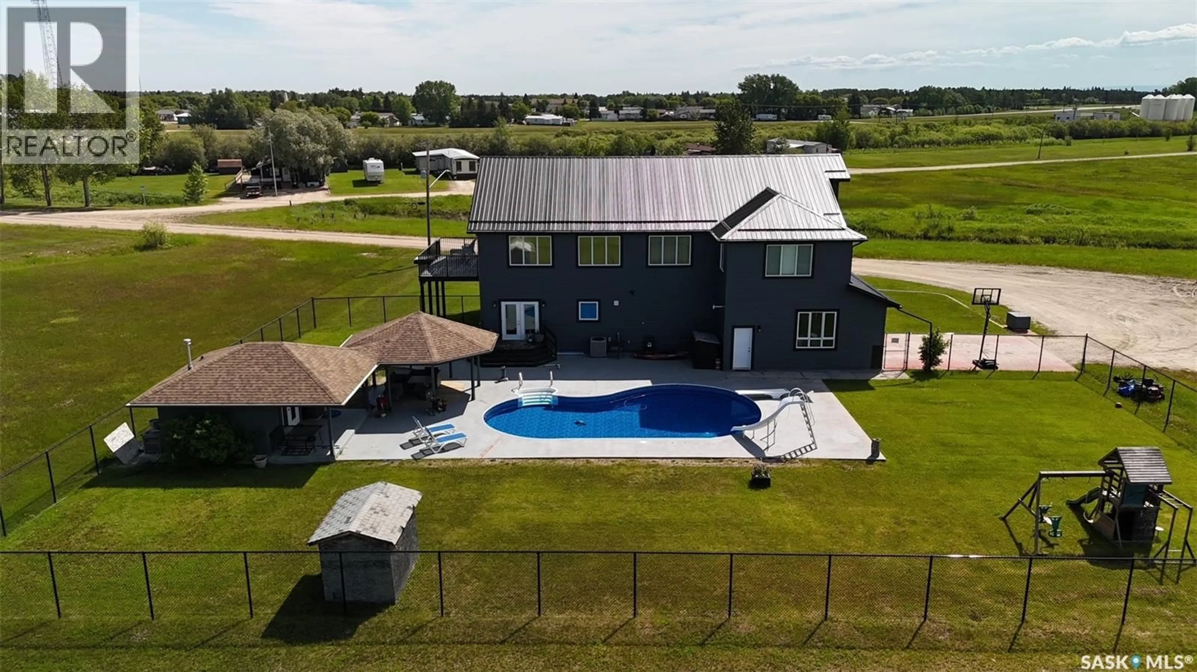 A pic from outside/outdoor area/front of a property/back of a property/a pic from drone, water/lake/river/ocean view for 701 BAY STREET, Hudson Bay Saskatchewan S0E0Y0