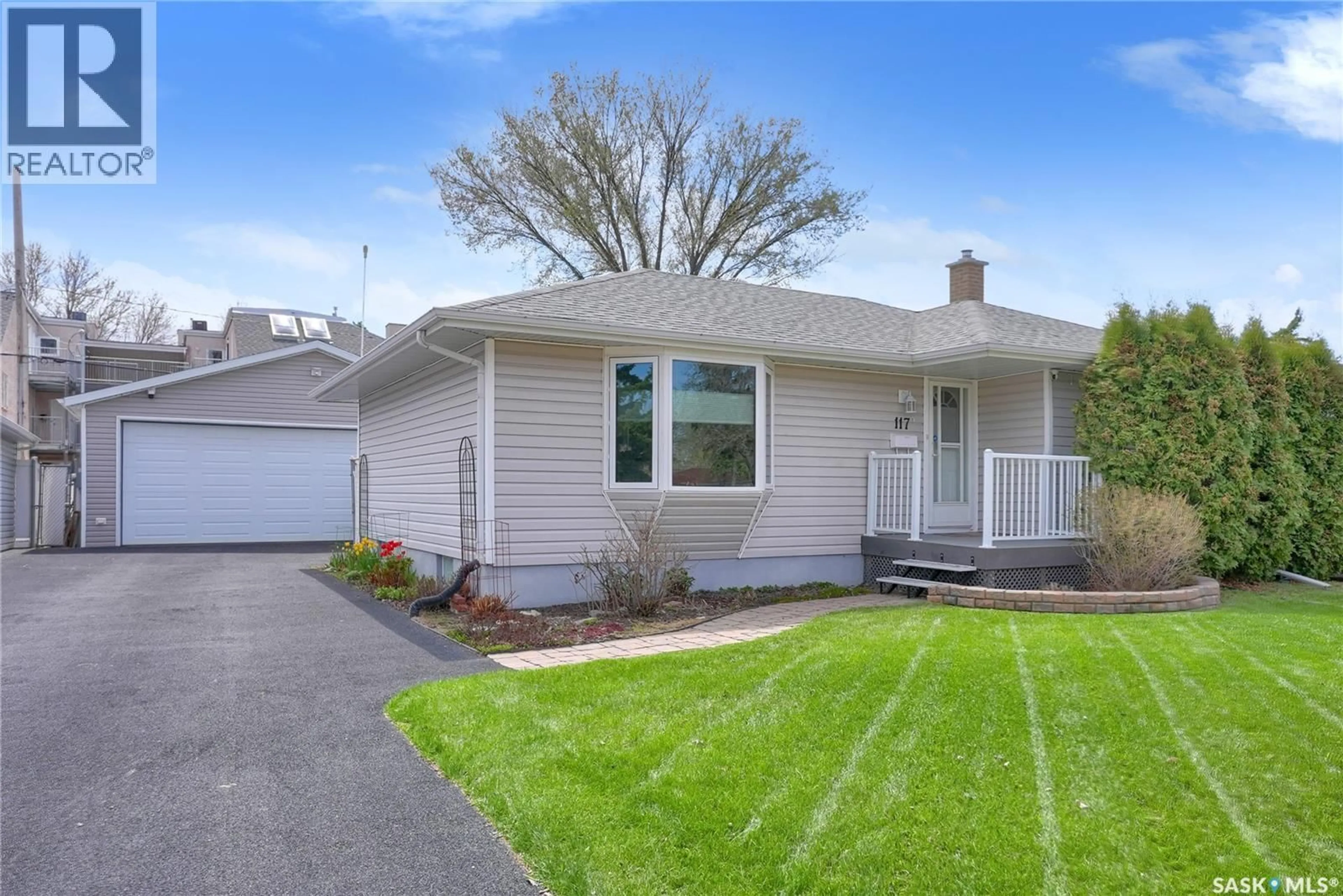 Home with vinyl exterior material, street for 117 DOUGLAS AVENUE, Regina Saskatchewan S4N1H2