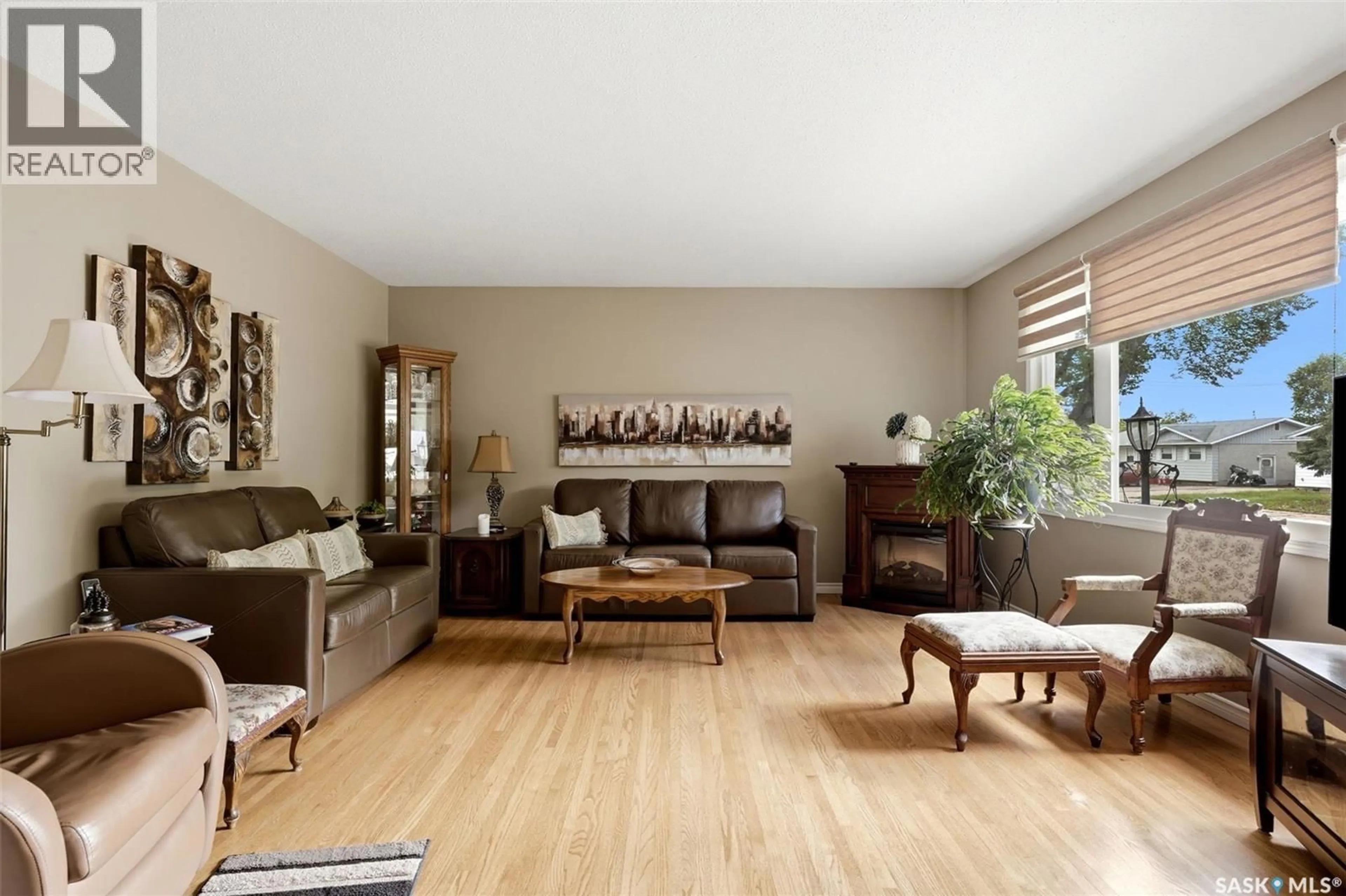 Living room with furniture, wood/laminate floor for 419 GARNET STREET, Regina Saskatchewan S4R3T2