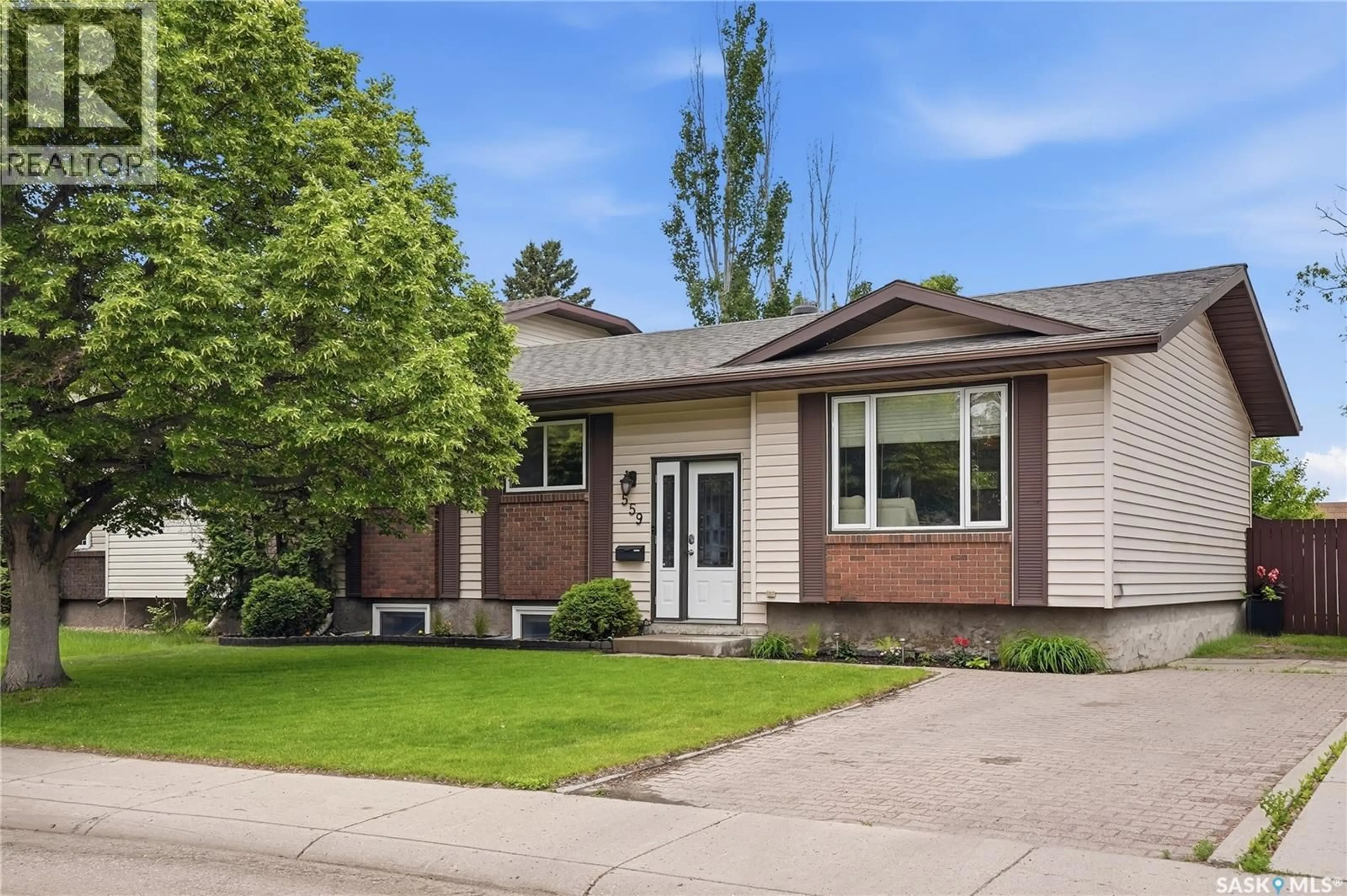 Home with vinyl exterior material, street for 559 NORDSTRUM ROAD, Saskatoon Saskatchewan S7K7X6