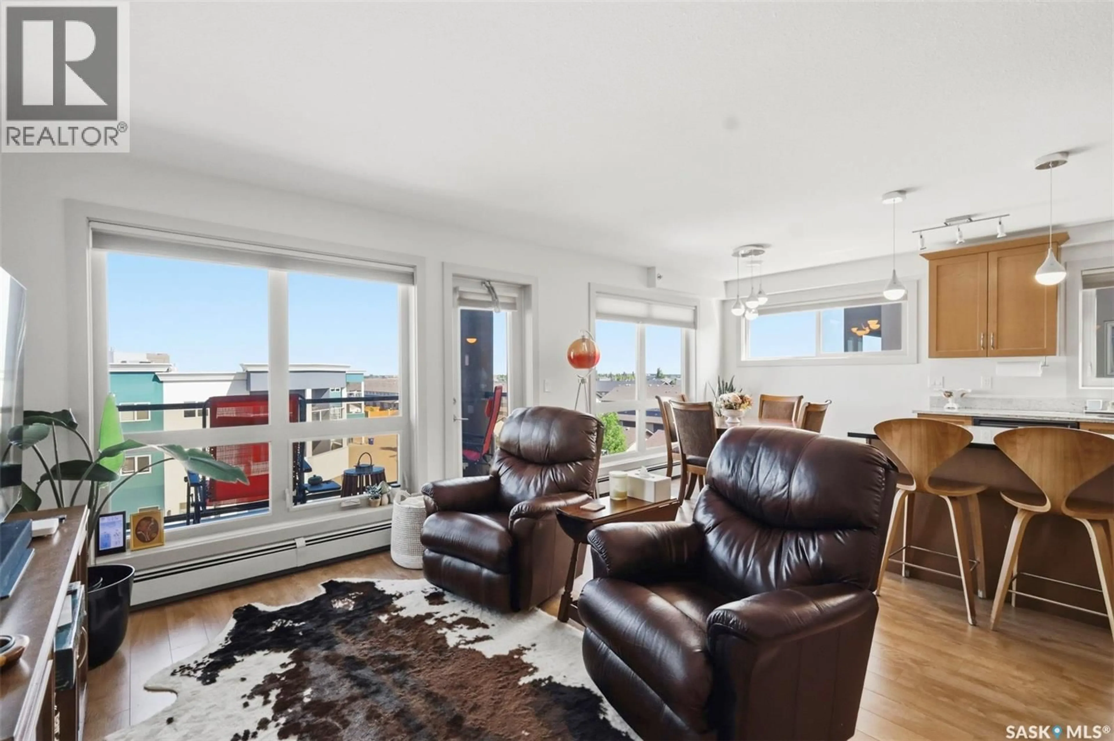 Living room with furniture, wood/laminate floor for 115 - 318 WILLOWGROVE CRESCENT, Saskatoon Saskatchewan S7W0N4