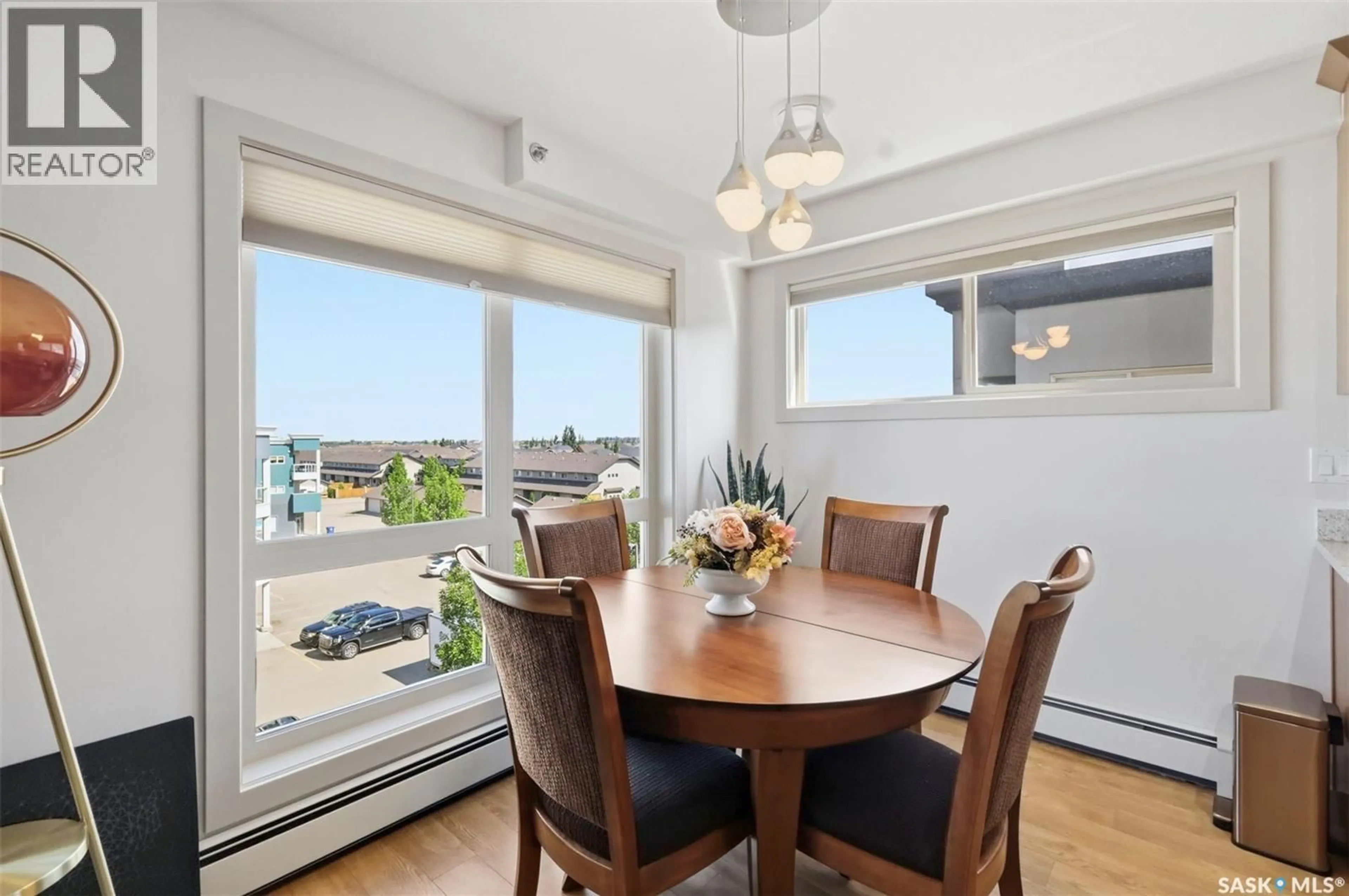 Dining room, wood/laminate floor for 115 - 318 WILLOWGROVE CRESCENT, Saskatoon Saskatchewan S7W0N4
