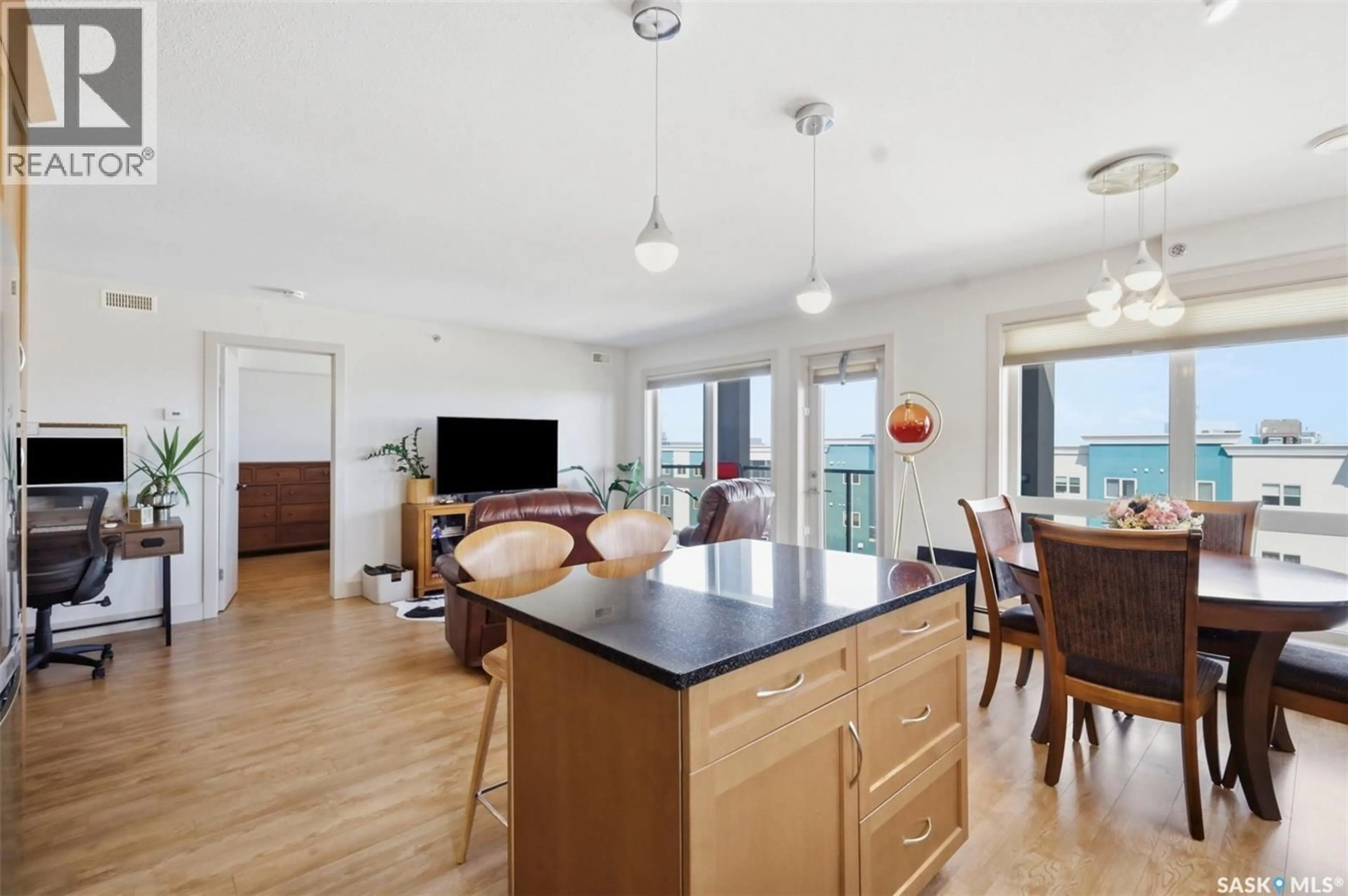Open concept kitchen, wood/laminate floor for 115 - 318 WILLOWGROVE CRESCENT, Saskatoon Saskatchewan S7W0N4