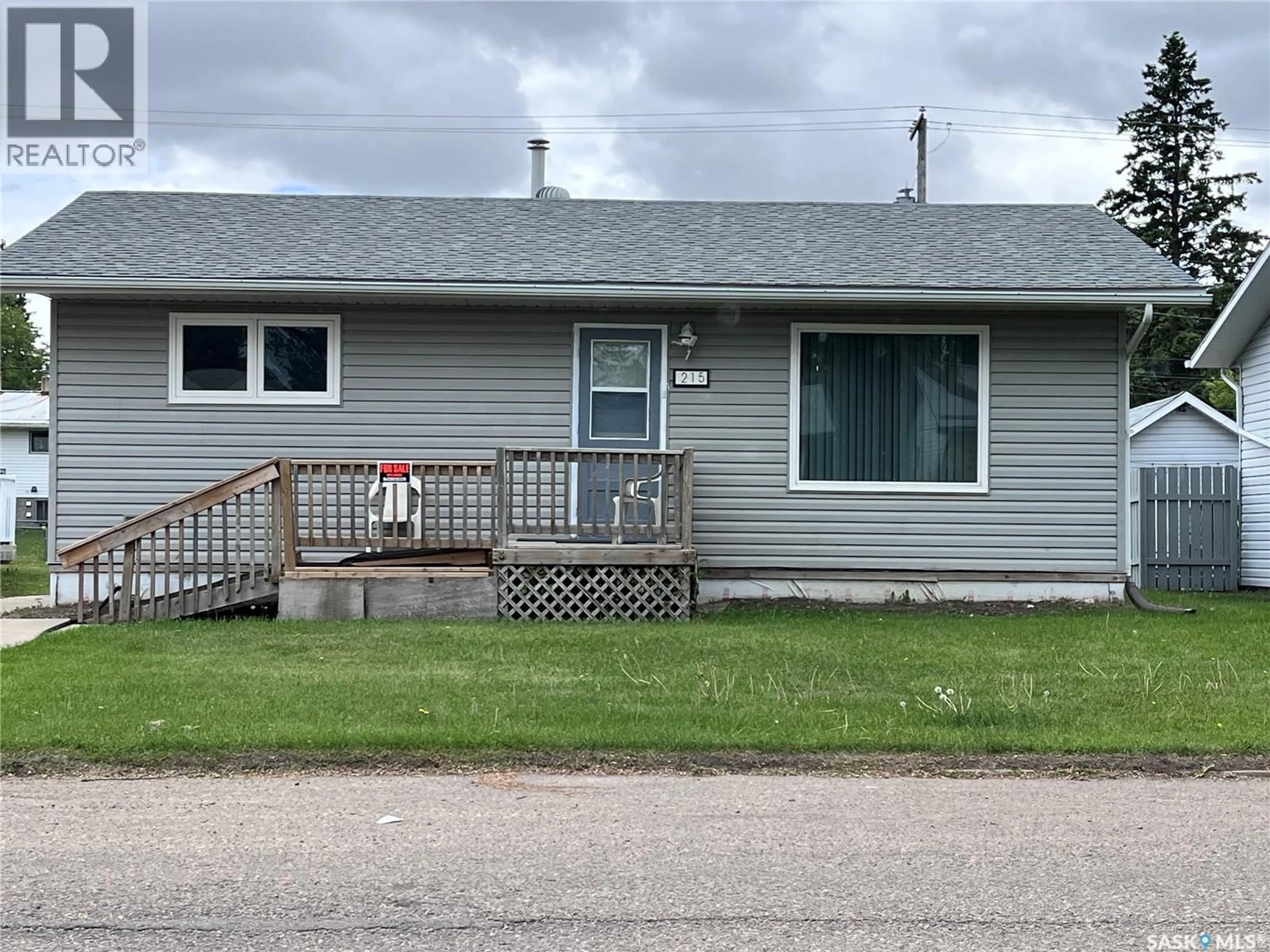 Home with vinyl exterior material, street for 215 BURNS AVENUE, Melfort Saskatchewan S0E1A0