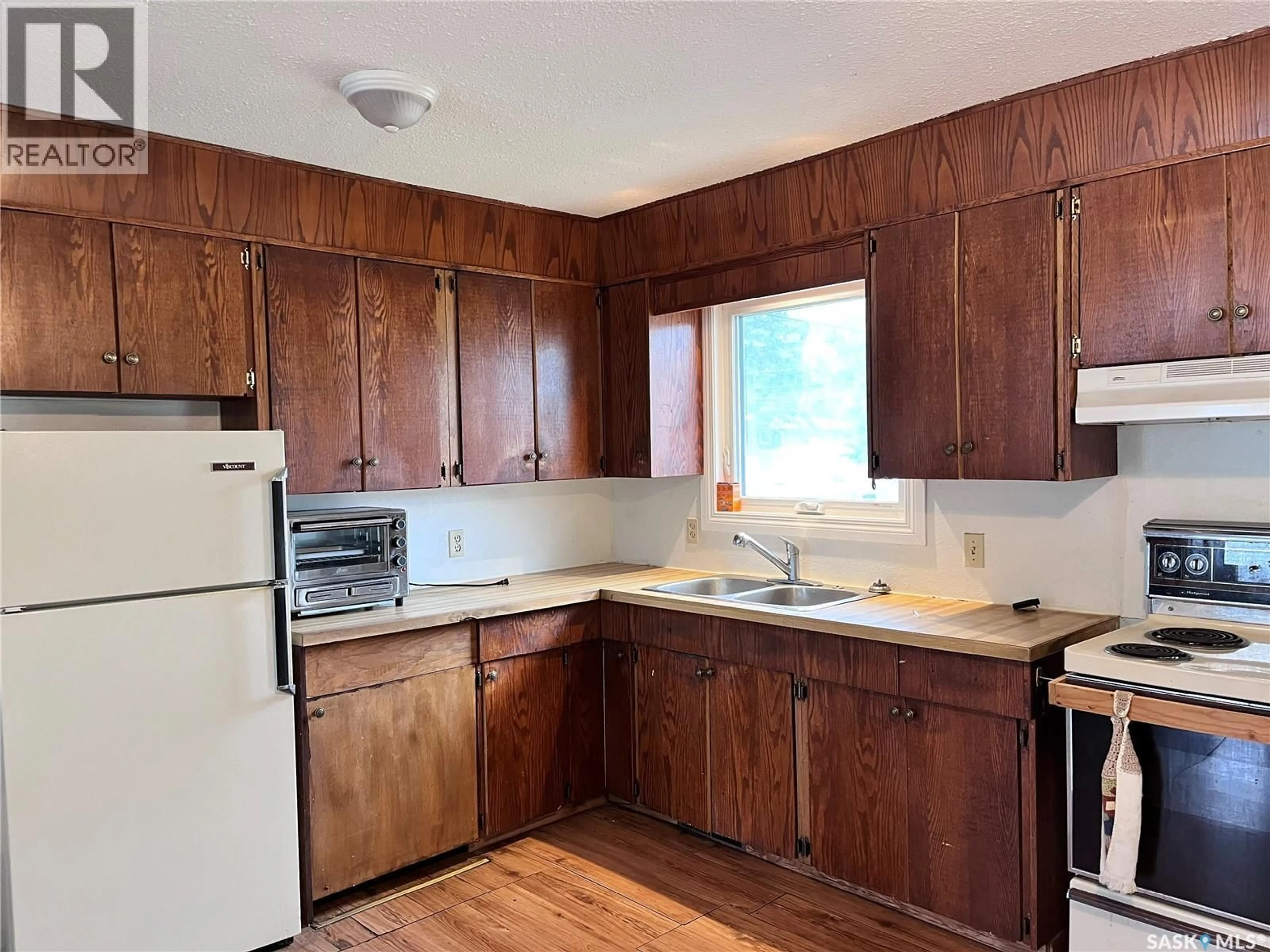 Standard kitchen, wood/laminate floor for 215 BURNS AVENUE, Melfort Saskatchewan S0E1A0