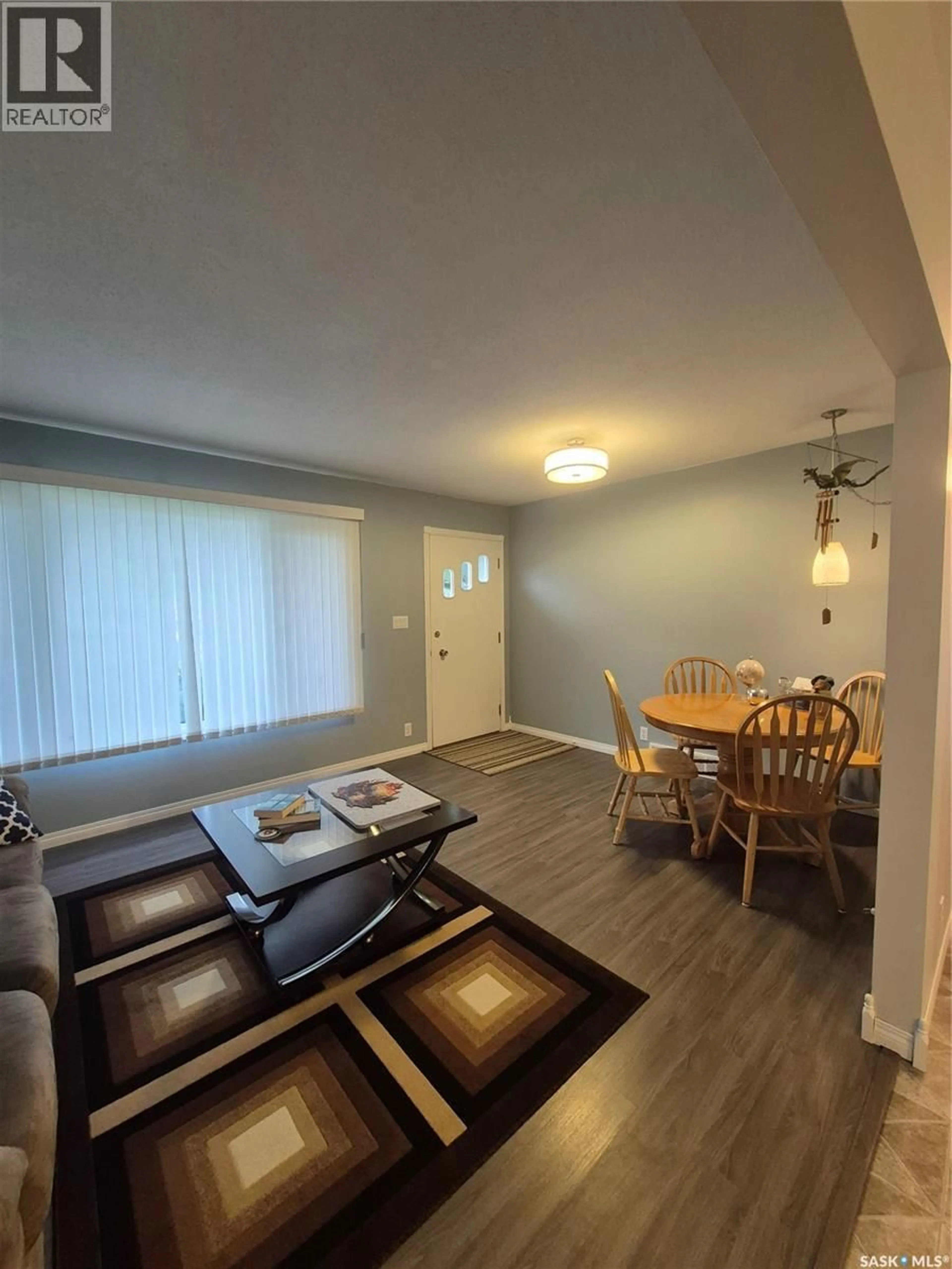 Living room with furniture, wood/laminate floor for 108 DOWNEY STREET, Strasbourg Saskatchewan S0G4V0
