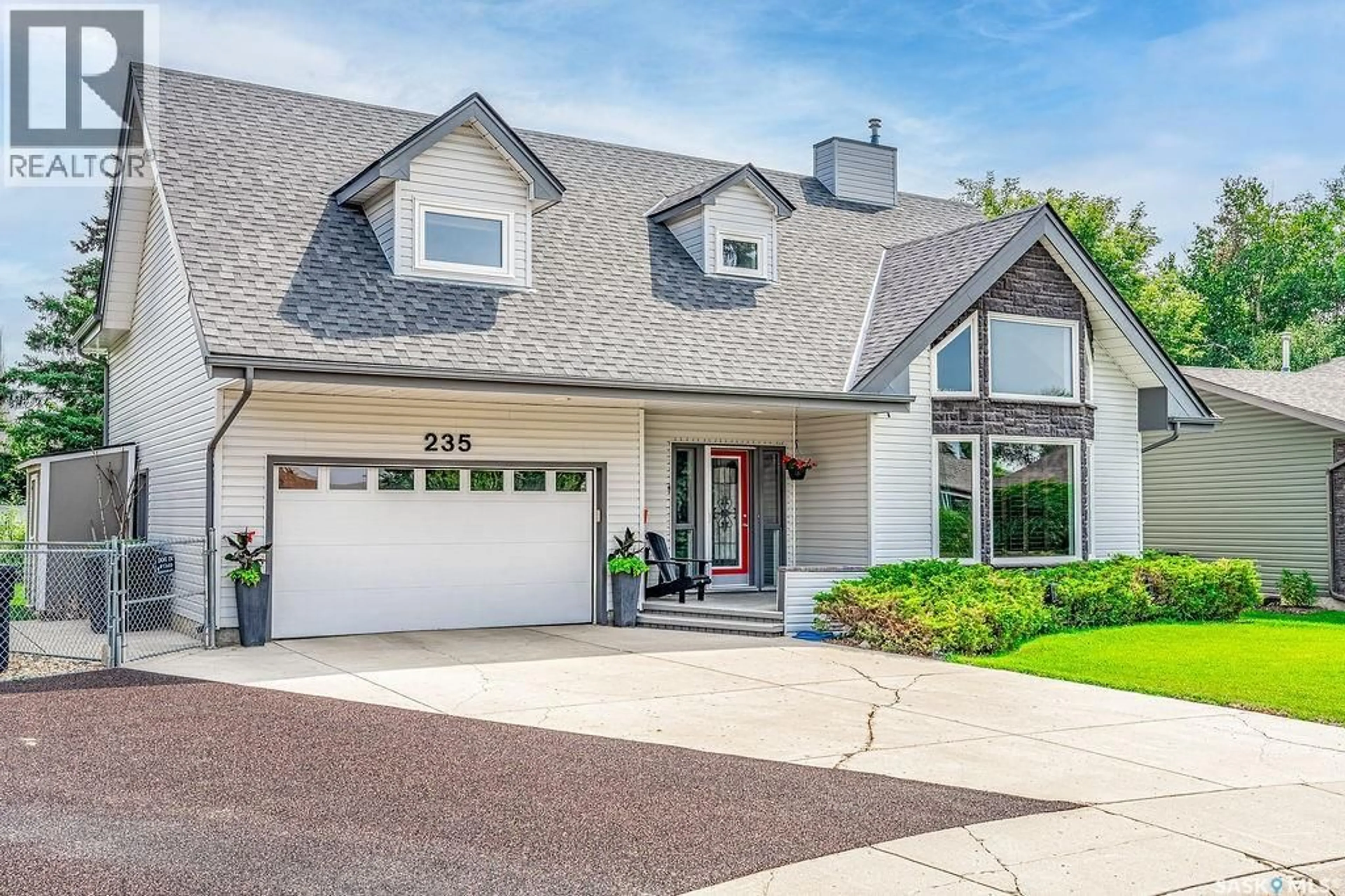 Home with vinyl exterior material, street for 235 SEBESTYEN TERRACE, Saskatoon Saskatchewan S7K6R8