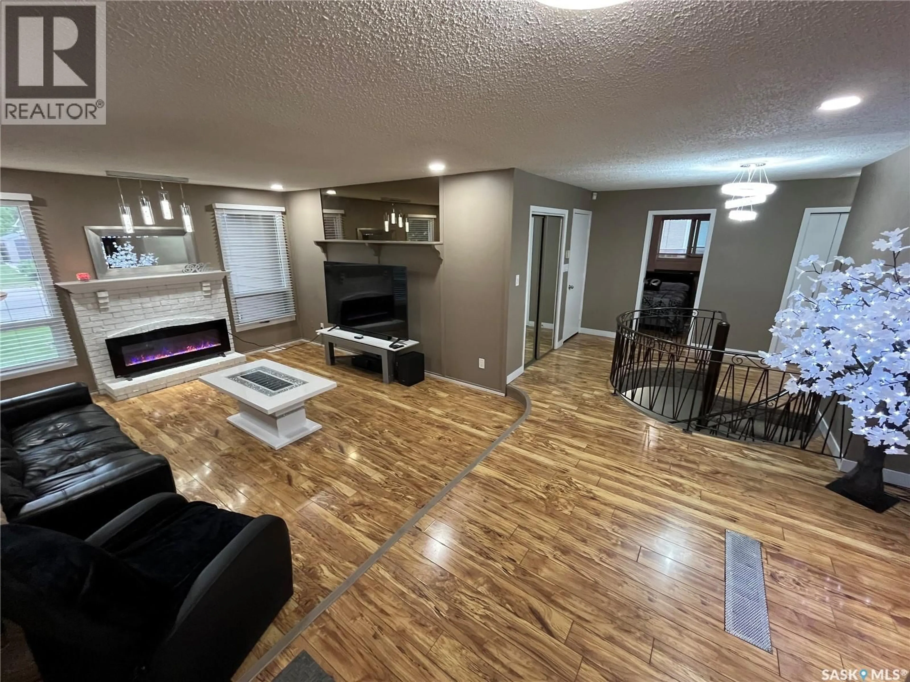 Living room with furniture, wood/laminate floor for 374 RODENBUSH DRIVE, Regina Saskatchewan S4R7L5
