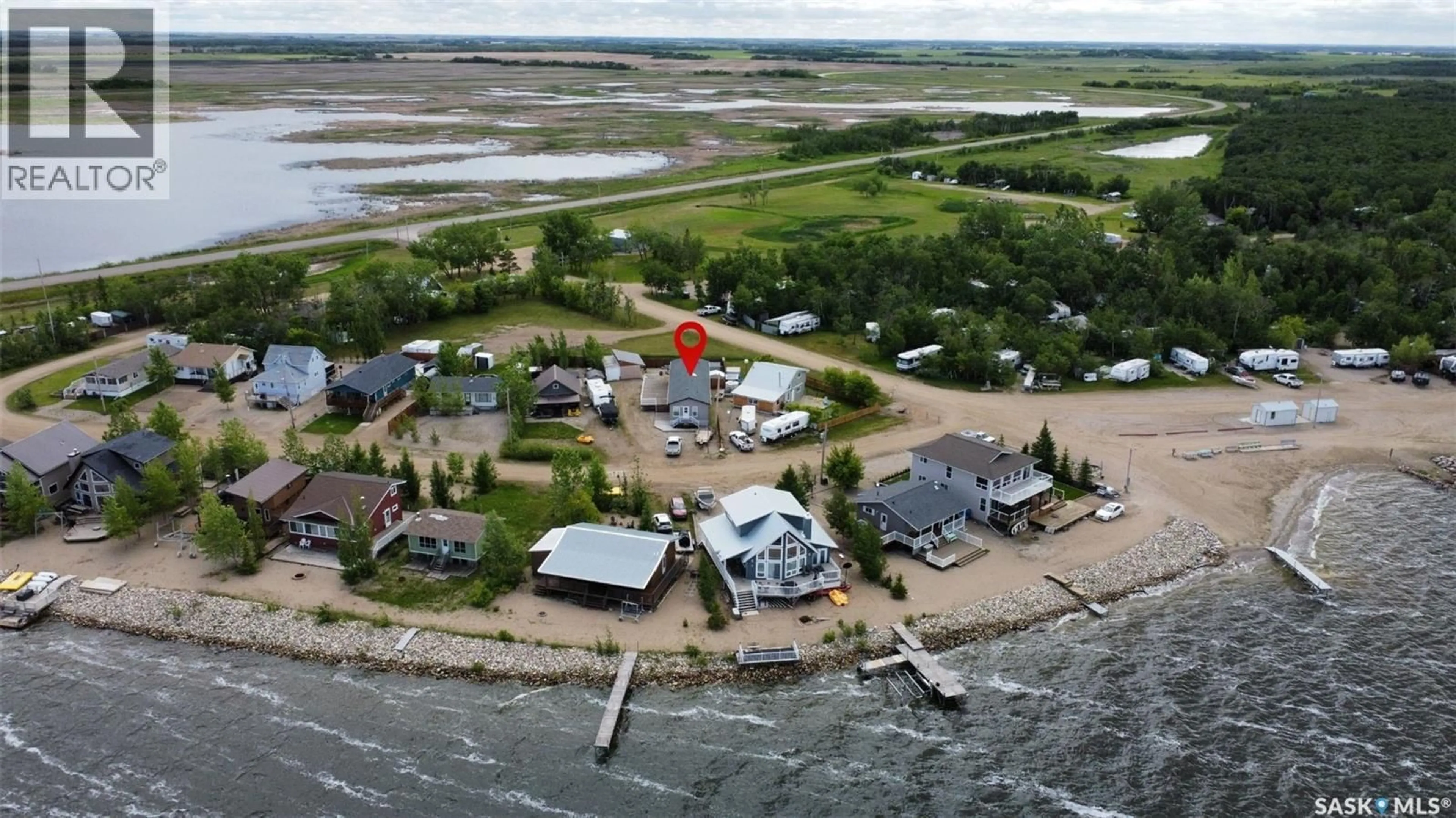A pic from outside/outdoor area/front of a property/back of a property/a pic from drone, water/lake/river/ocean view for 11 ISABELLA PLACE, Fishing Lake Saskatchewan S0A1A0