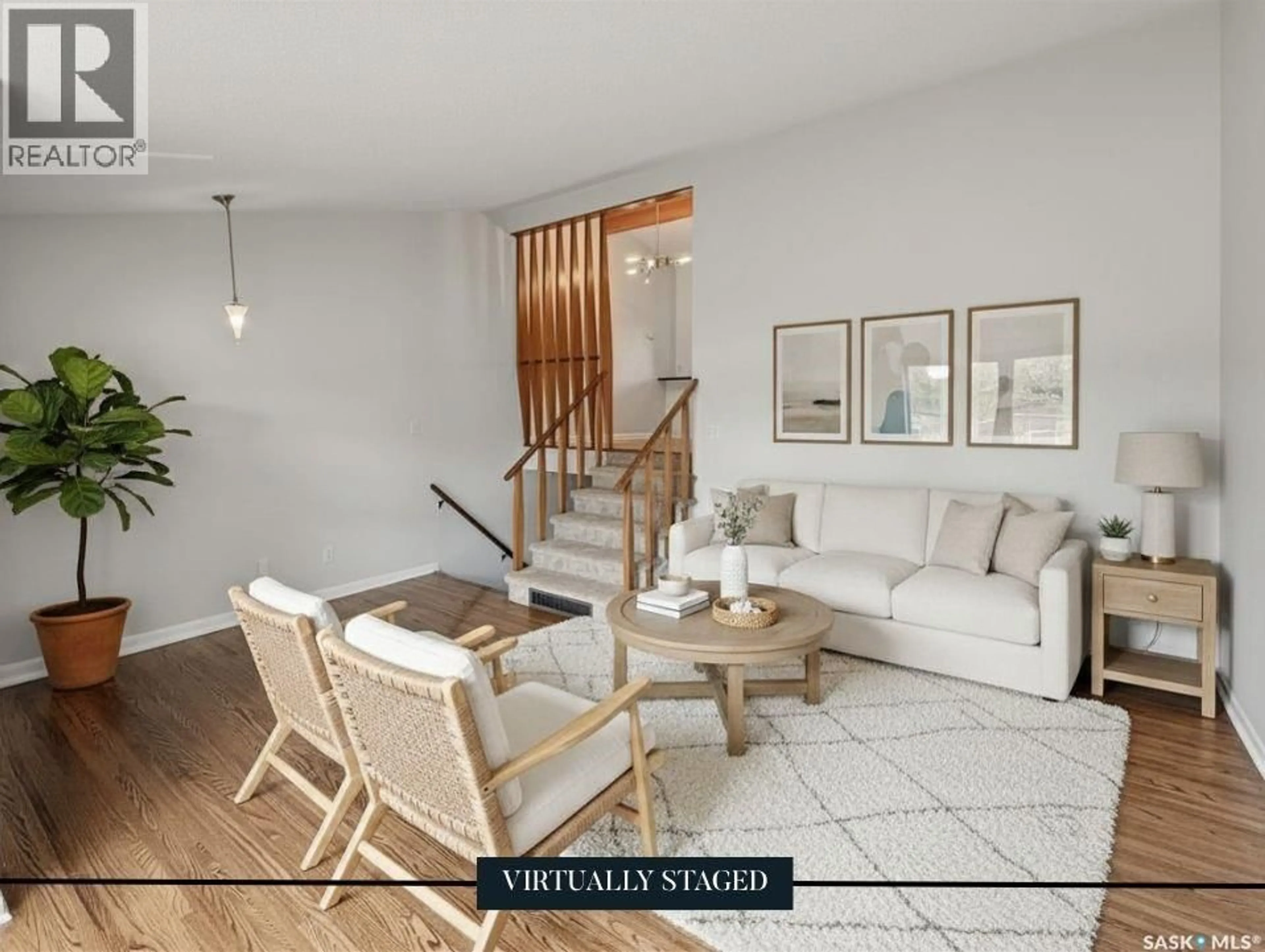Living room with furniture, wood/laminate floor for 18 628 1ST AVENUE, Swift Current Saskatchewan S9H2B9