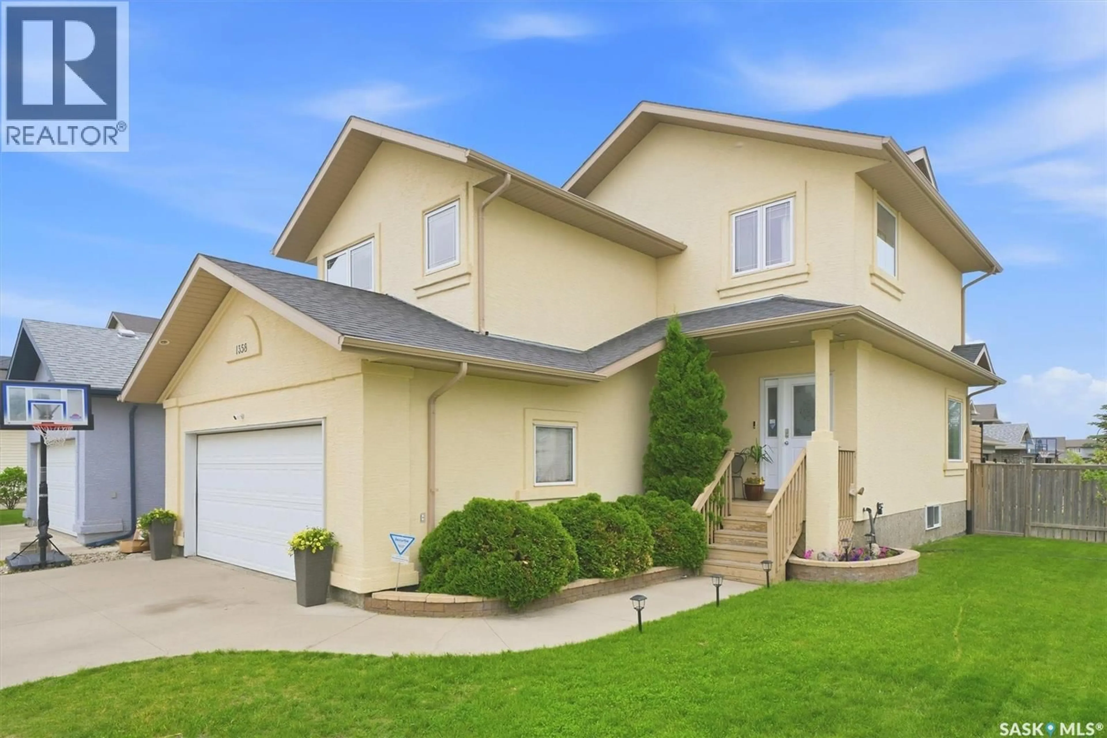 Home with vinyl exterior material, street for 1358 DENHAM CRESCENT, Saskatoon Saskatchewan S7R0B1