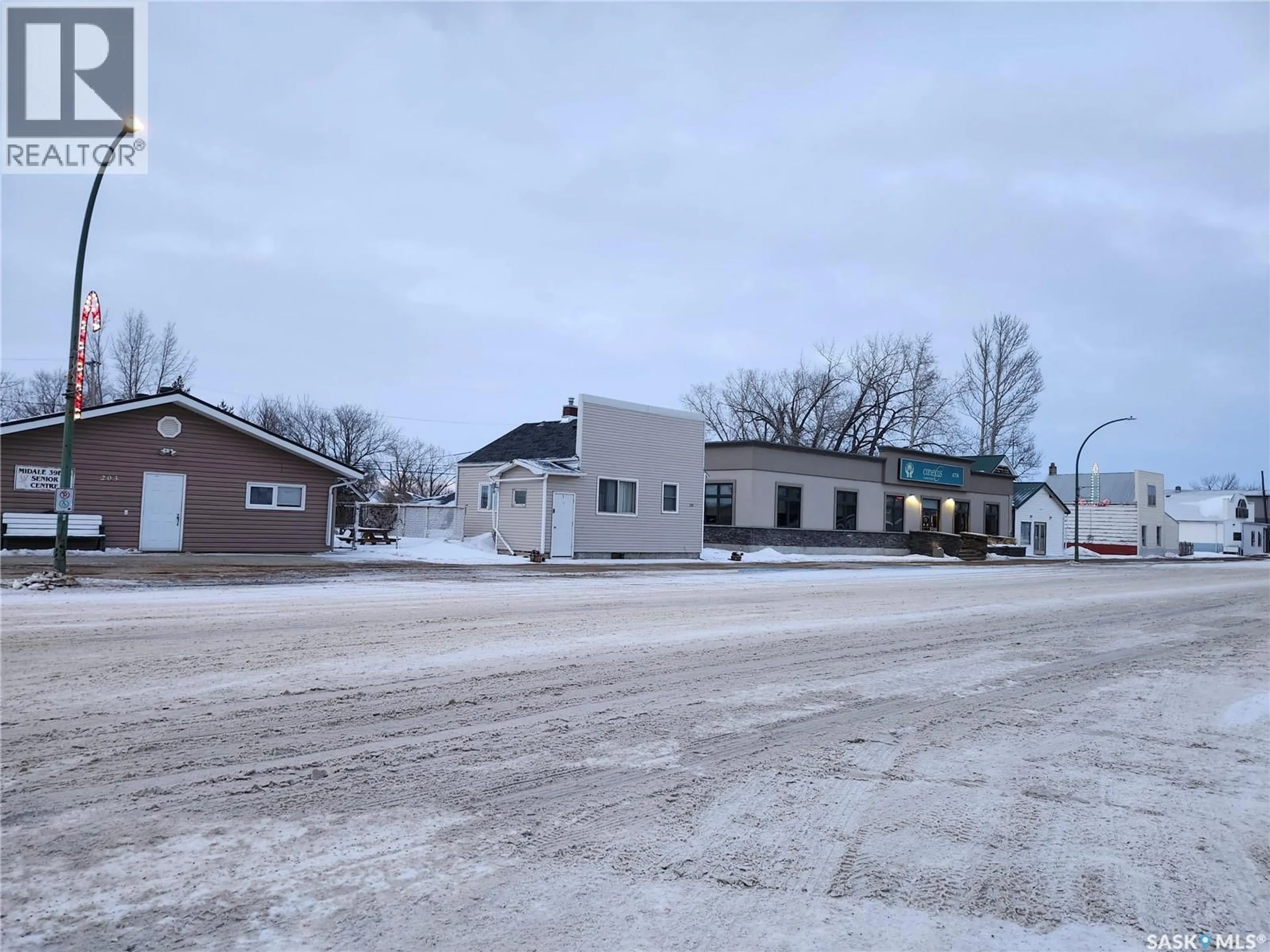 A pic from outside/outdoor area/front of a property/back of a property/a pic from drone, building for 205 MAIN STREET, Midale Saskatchewan S0C1S0