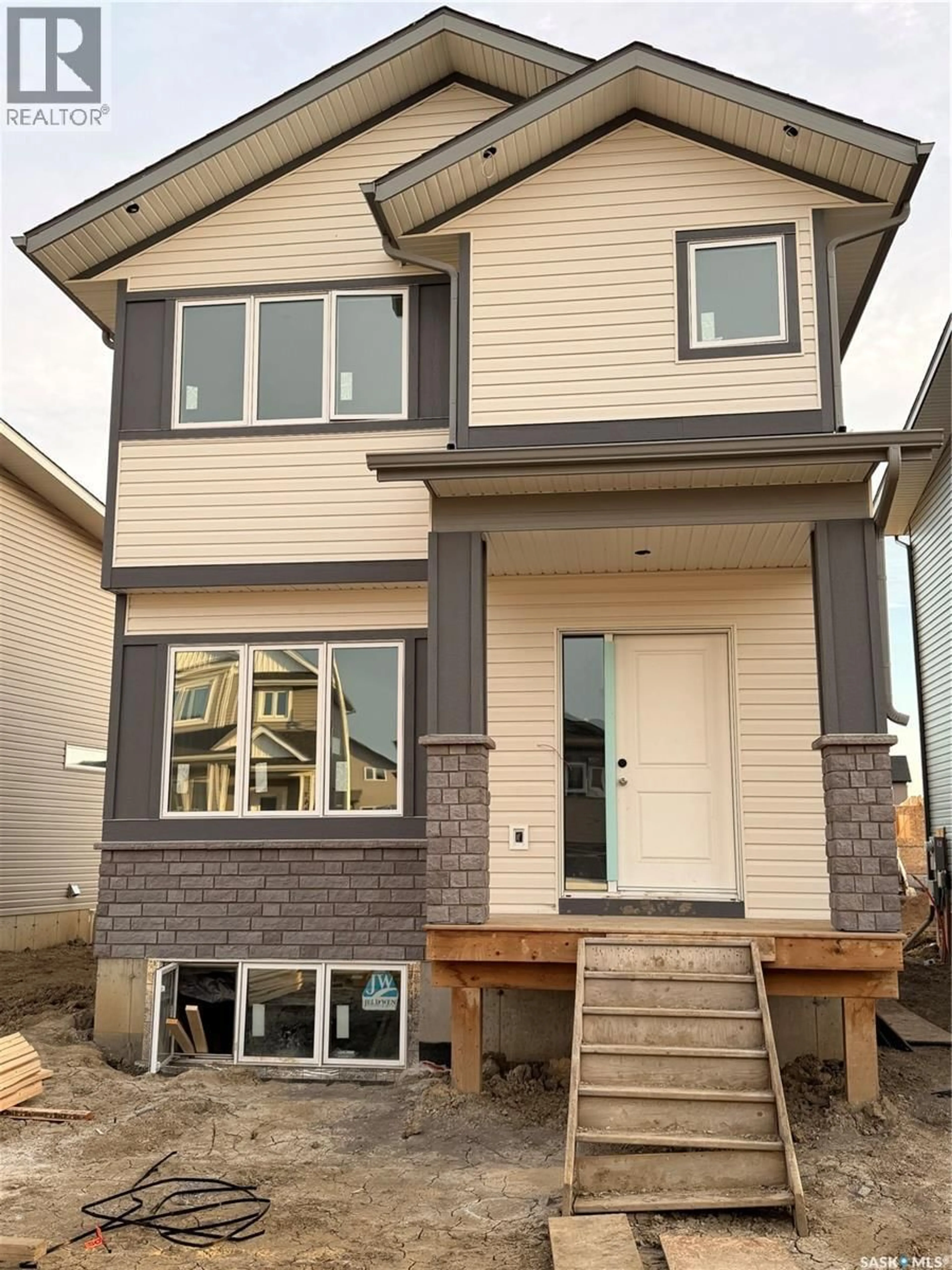 Home with vinyl exterior material, street for 1428 BESNARD DRIVE, Martensville Saskatchewan S0K2T1
