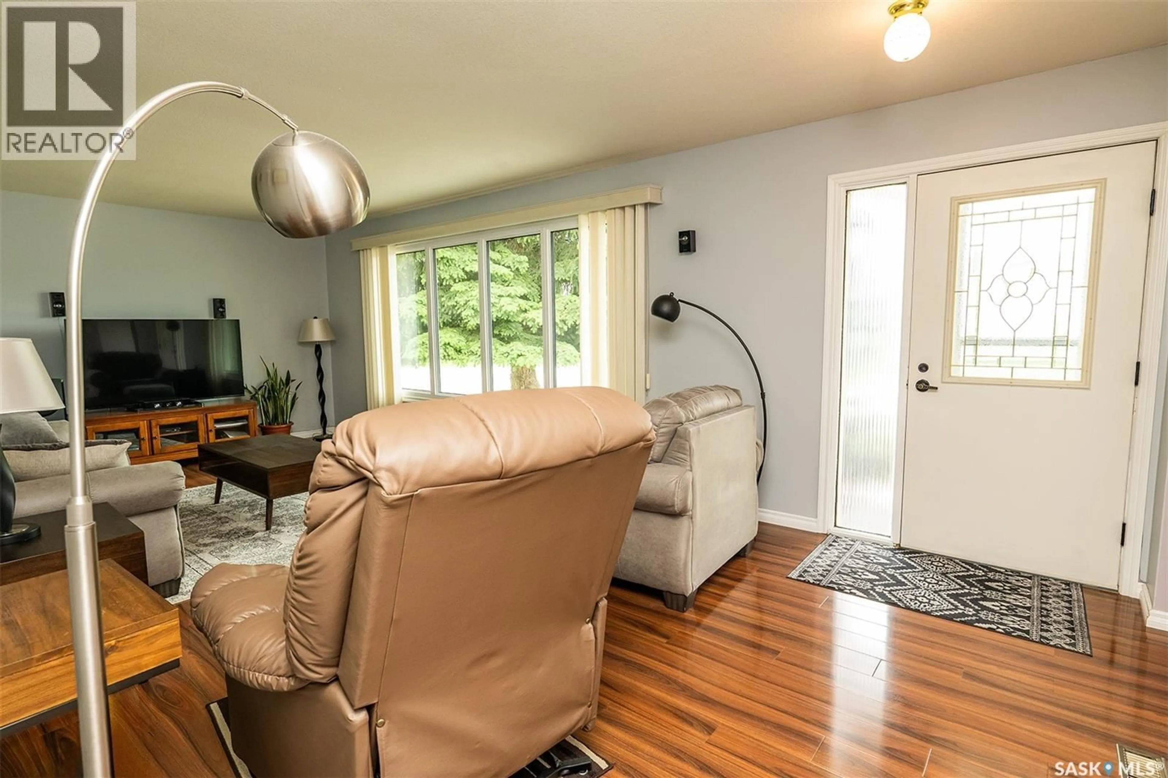 Living room with furniture, wood/laminate floor for 217 8TH STREET, Wynyard Saskatchewan S0A4T0