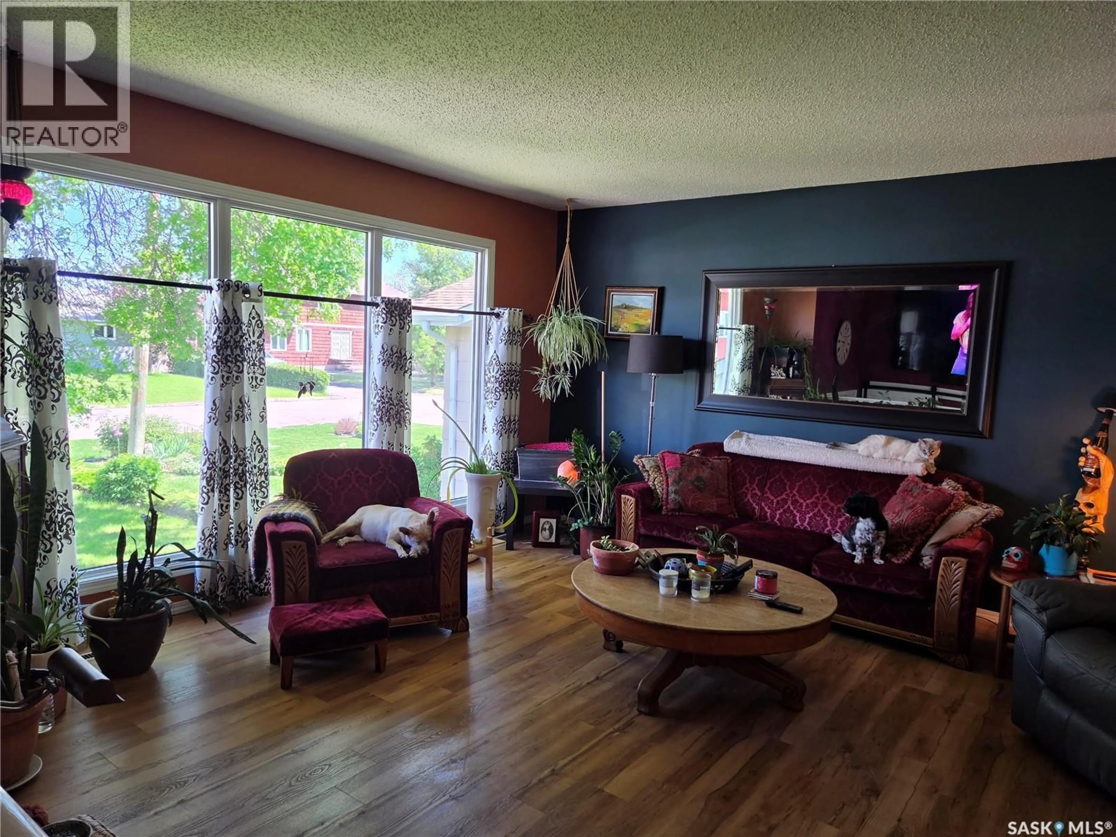 Living room with furniture, wood/laminate floor for 519 1ST STREET, Wadena Saskatchewan S0A4J0