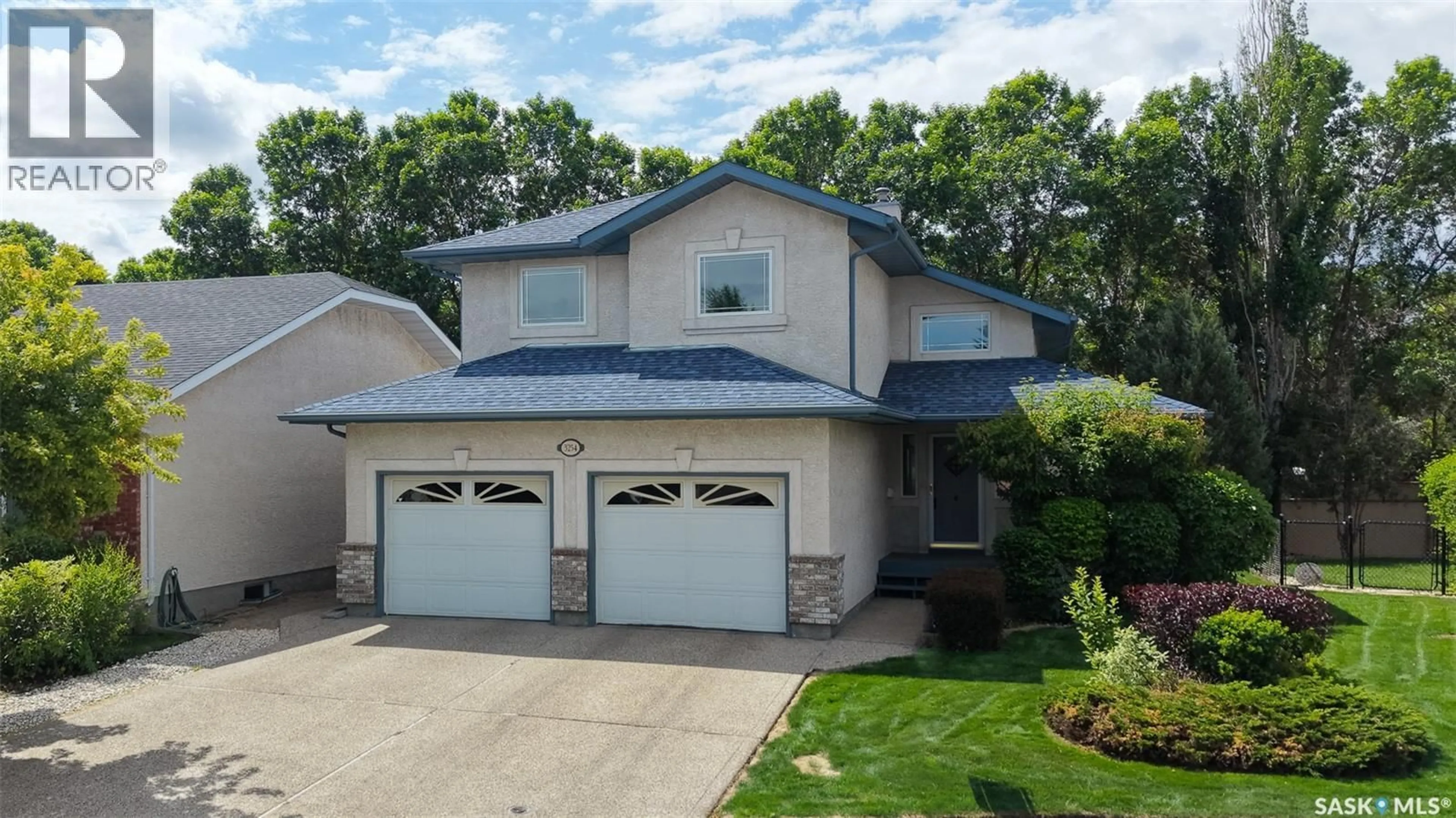 Home with vinyl exterior material, street for E - 3254 PEYSON BAY, Regina Saskatchewan S4V2W8